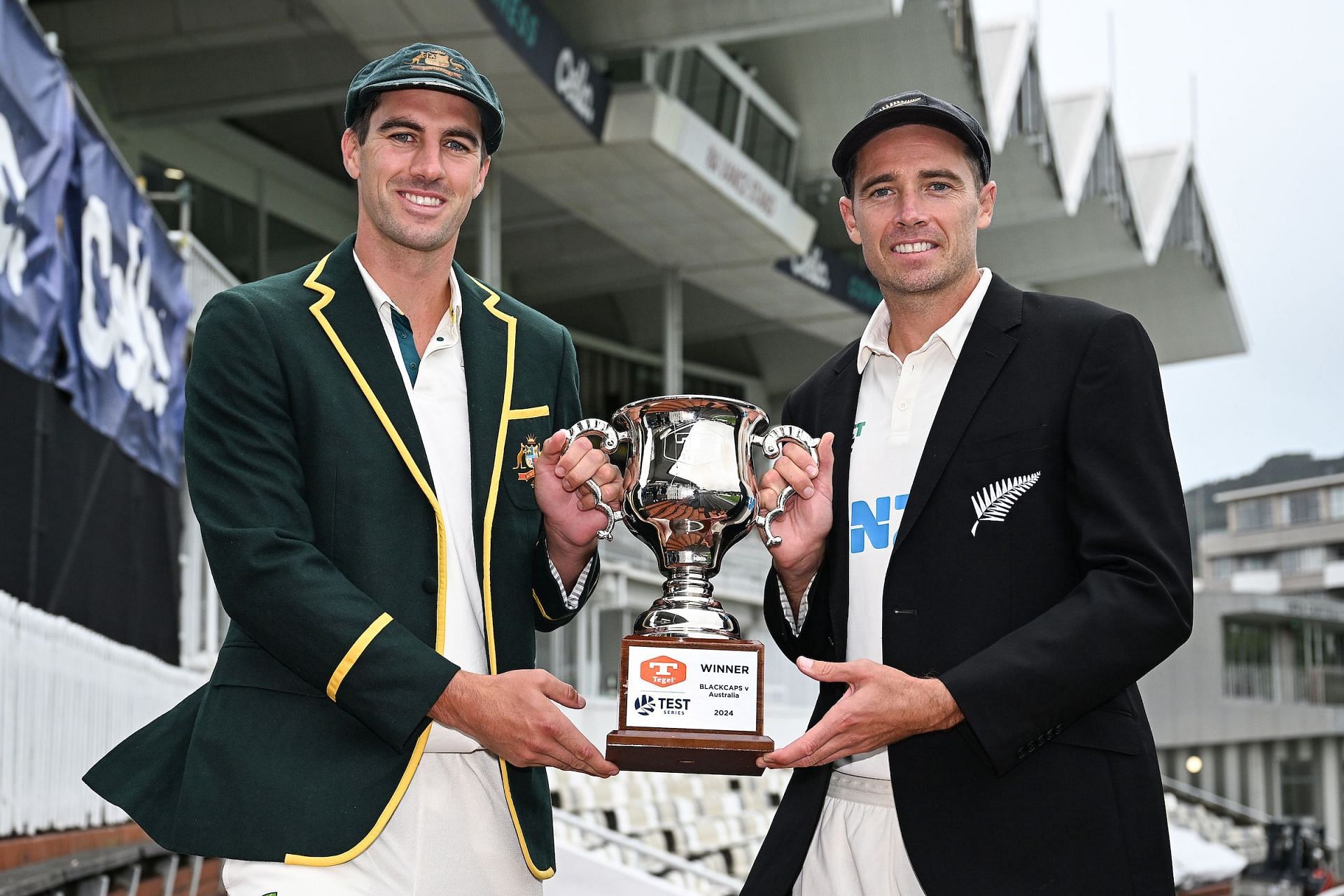 Pat Cummins and Tim Southee posing with the Trans-Transman Trophy