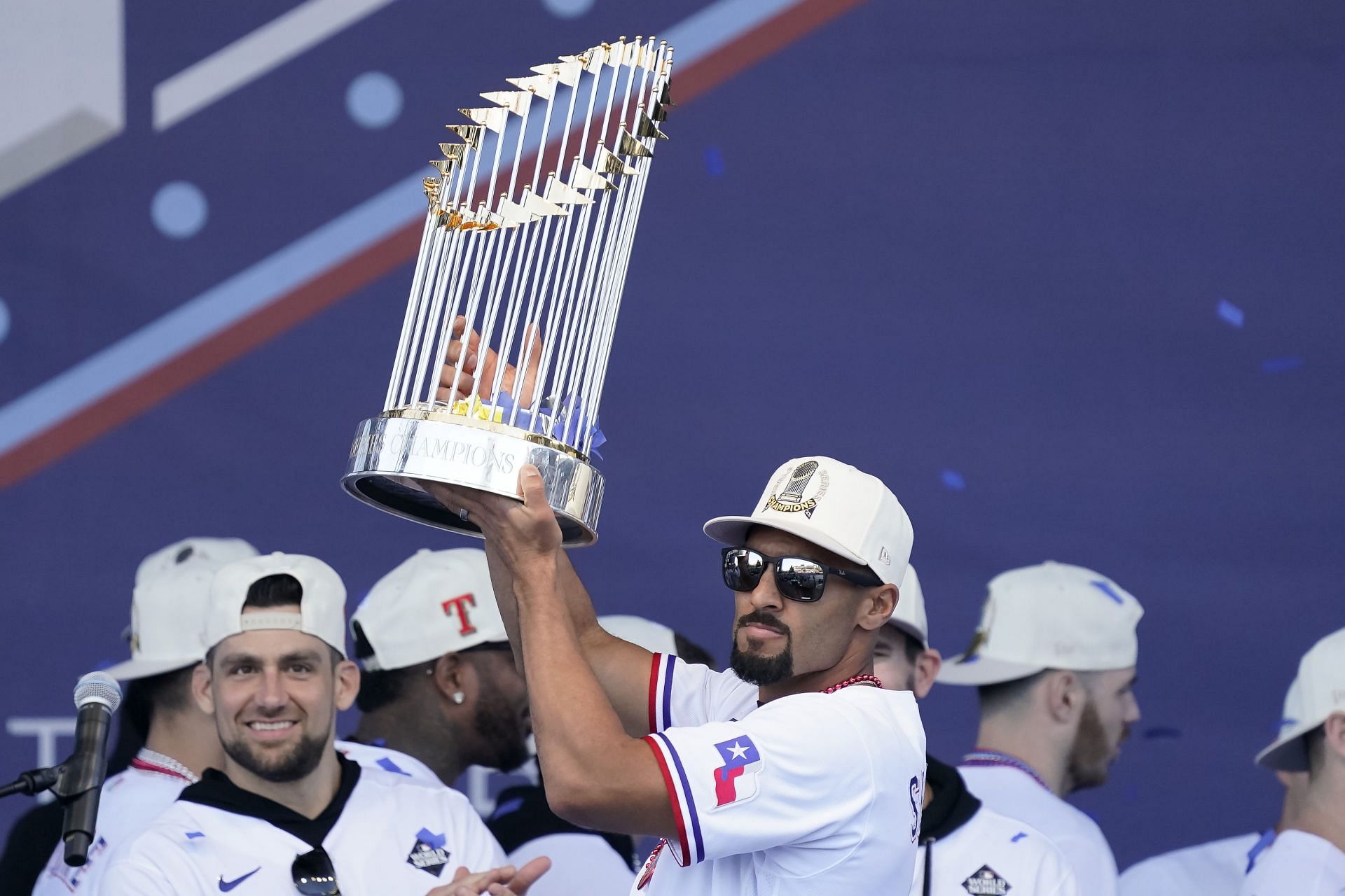 Semien celebrates with the World Series trophy