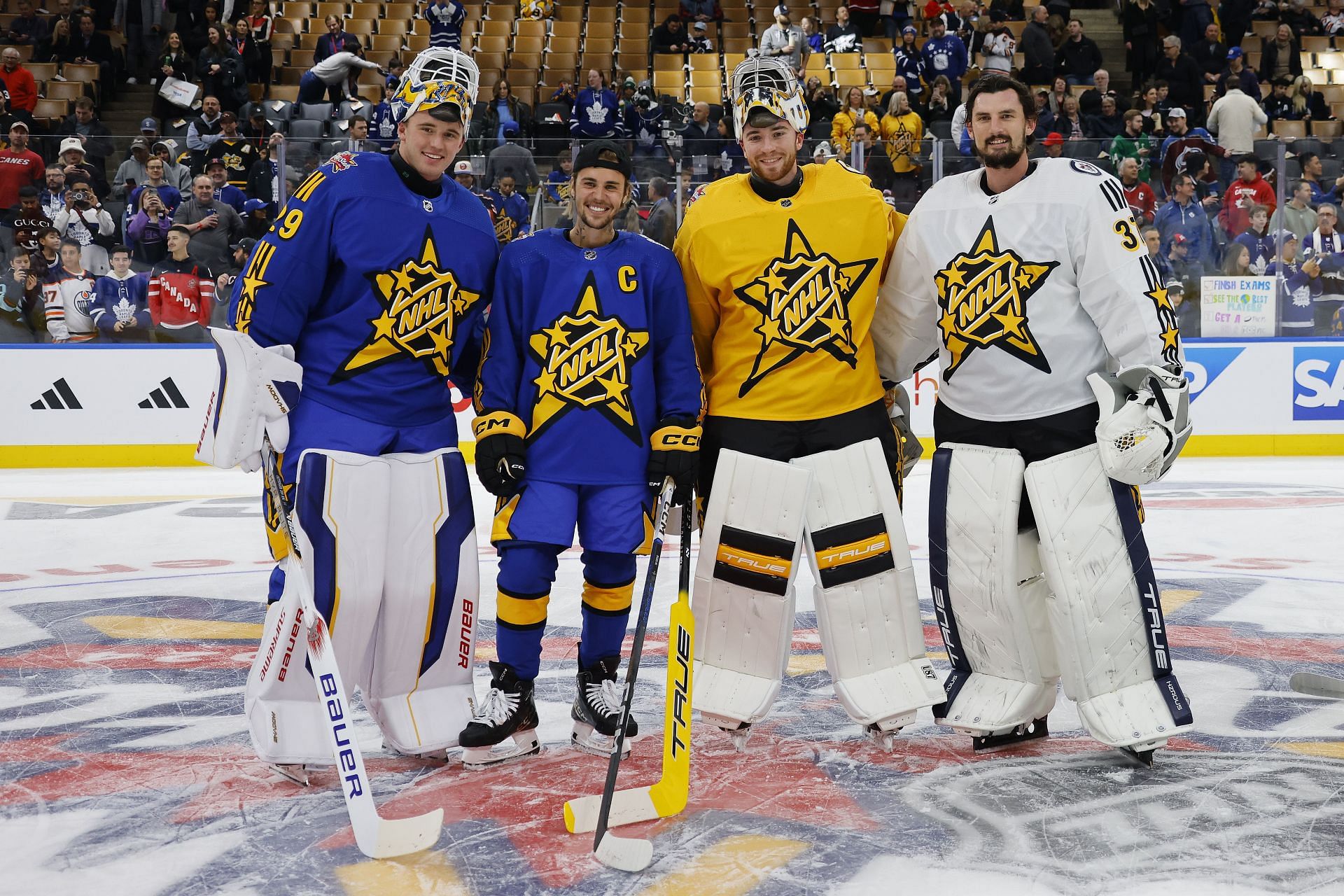 Jake Oettinger, Justin Bieber, Jeremy Swayman, and Connor Hellebuyck at the 2024 NHL All-Star Game