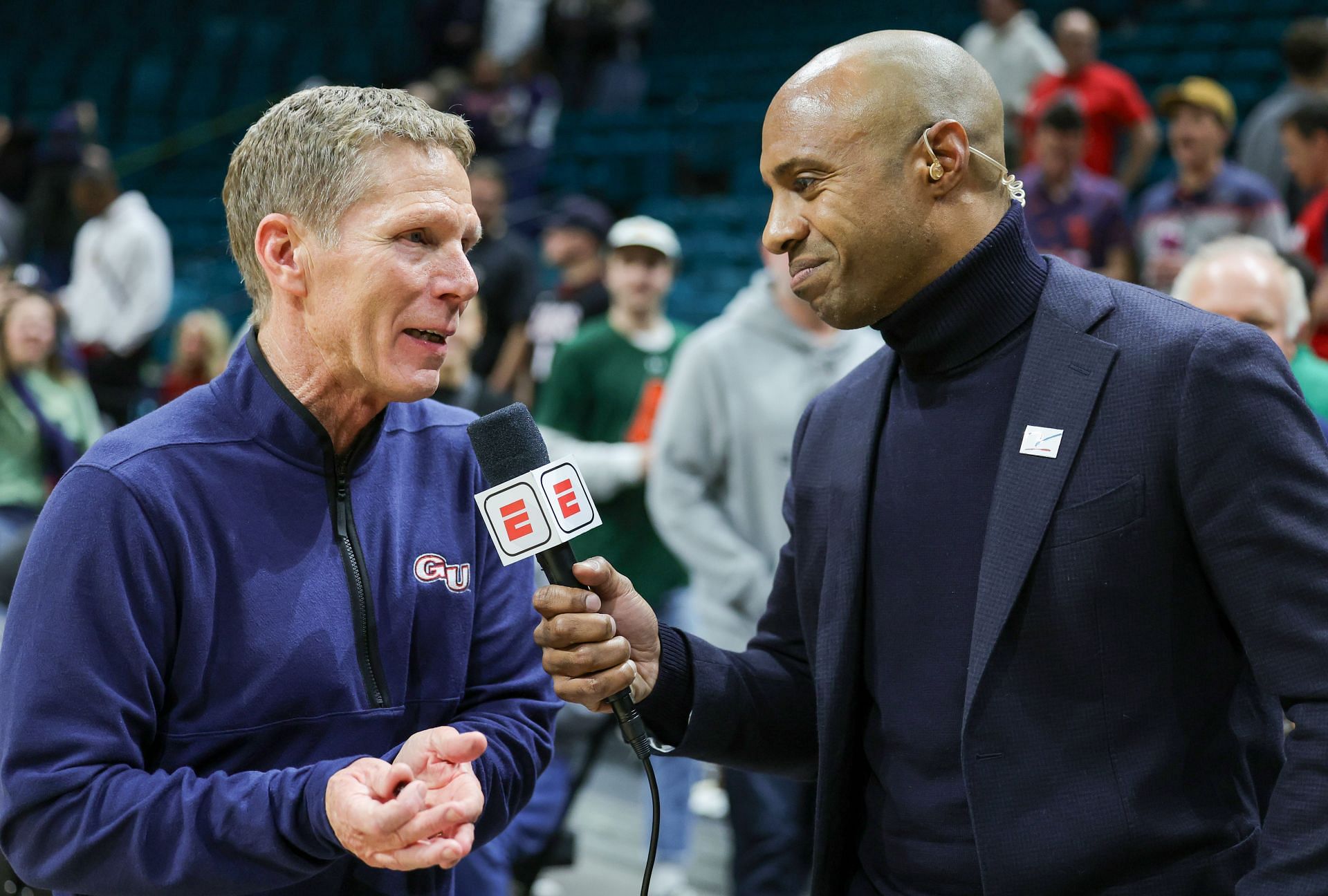 Head coach Mark Few (left) of the Gonzaga Bulldogs is interviewed by ESPN&#039;s Jay Williams