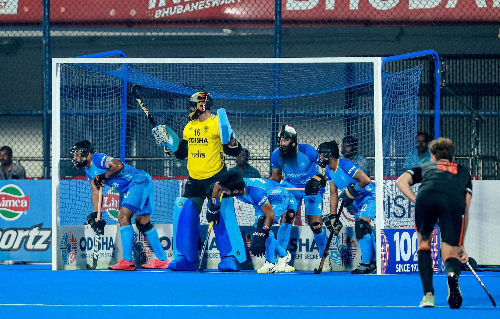 Indian players defend a penalty corner