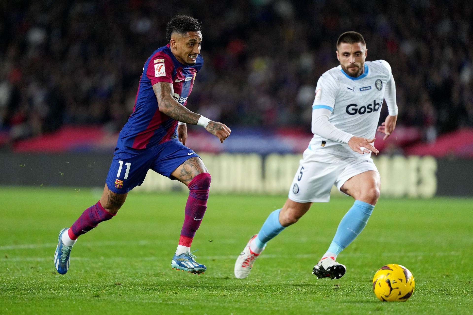 Raphinha (left) has struggled to live up to expectations at the Camp Nou.