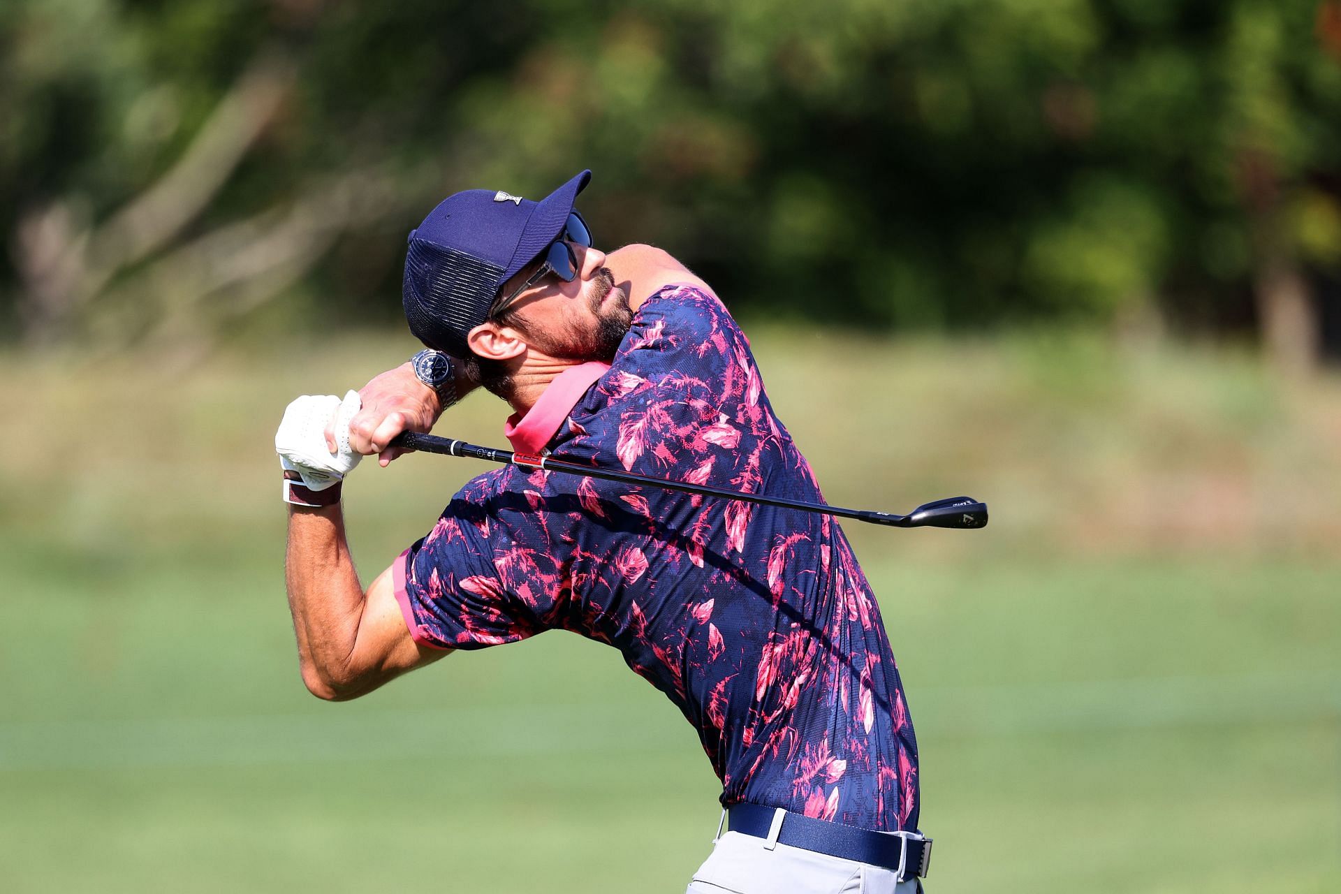 Michael Phelps plays a shot during the Gardner Heidrick Pro-Am ahead of the BMW Championship at Caves Valley Golf Course in Owings Mills, Maryland.