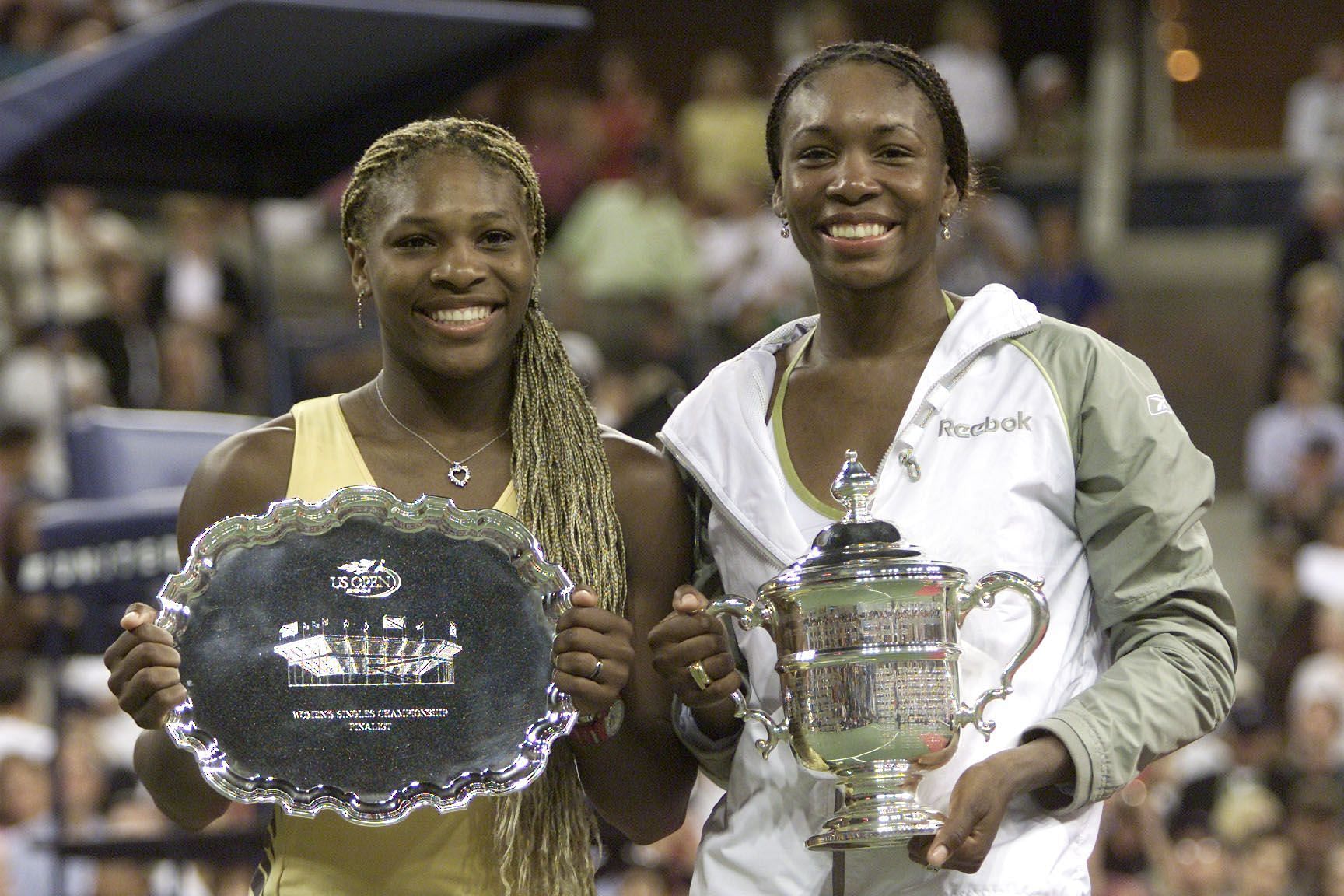 Serena Williams [L] and Venus Williams at the 2001 US Open Trophy Ceremony