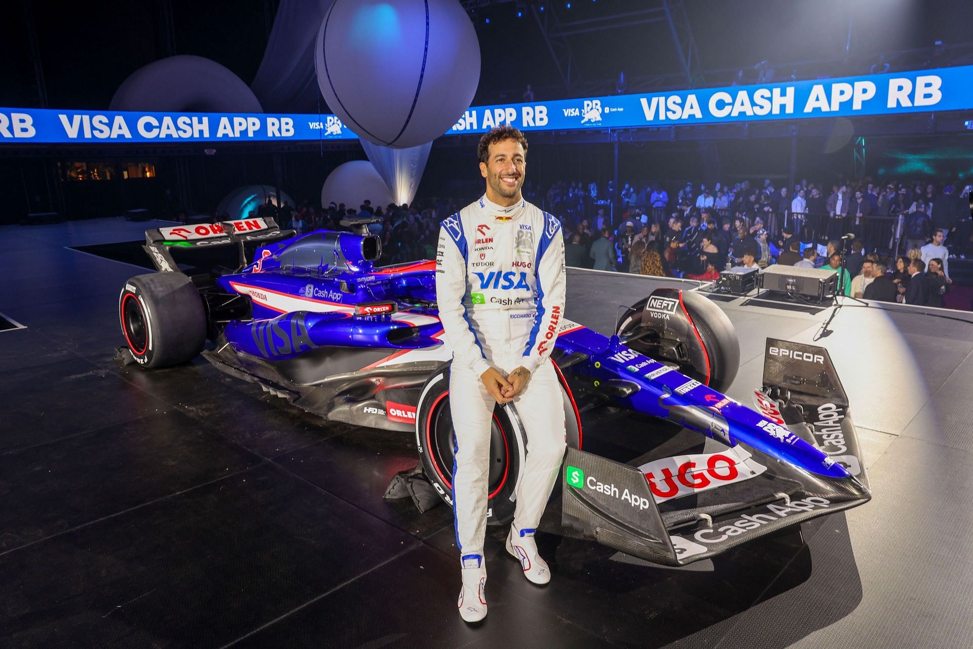 2024 Visa Cash App RB Car Launch in Las Vegas LAS VEGAS, NEVADA - FEBRUARY 08: Daniel Ricciardo of Australia and Visa Cash App RB poses for a photo with the Visa Cash App RB VCARB 01 at the Visa Cash App RB Livery Launch Event Las Vegas on February 08, 2024 in Las Vegas, Nevada. (Photo by Jesse Grant/Getty Images for Visa Cash App RB)