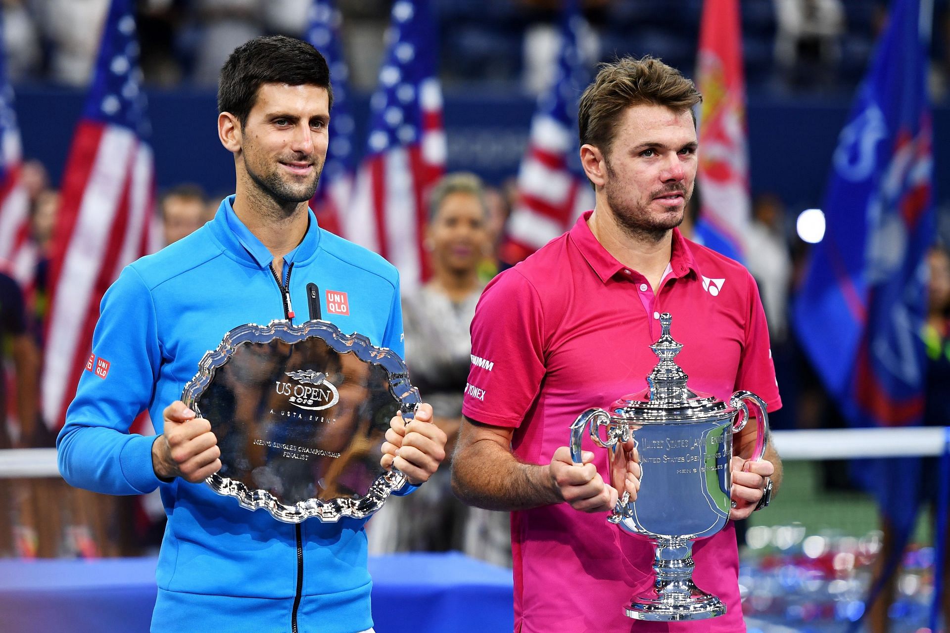 Novak Djokovic (L) and Stan Wawrinka at the 2016 US Open trophy ceremony