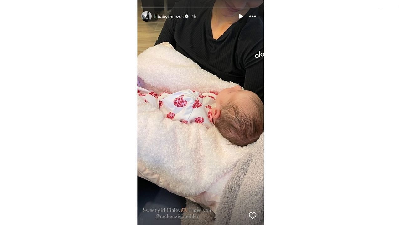 Chase Carter holding Walker Buehler&#039;s daughter