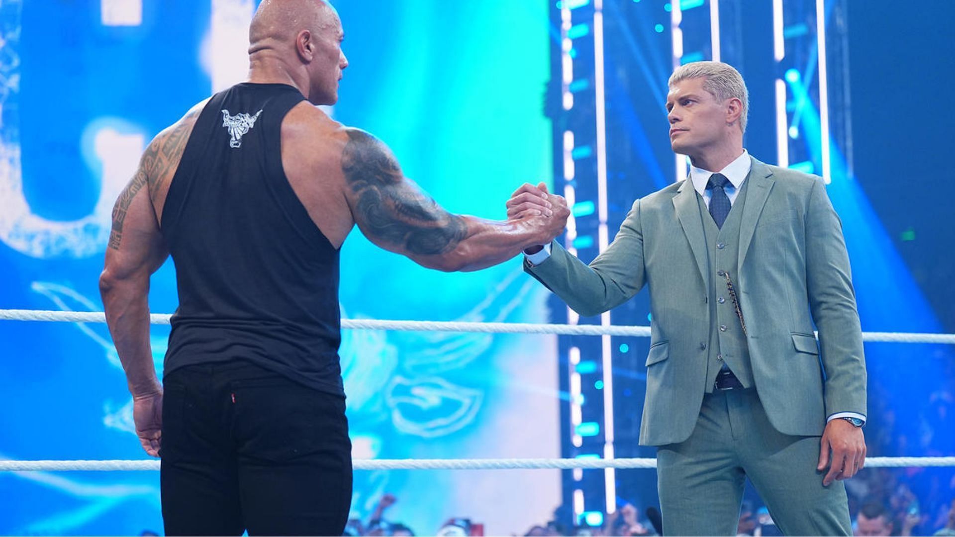 The Rock (left) and Cody Rhodes (right) negotiated a deal on SmackDown.