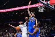 OKC Thunder rookie center Chet Holmgren (middle)