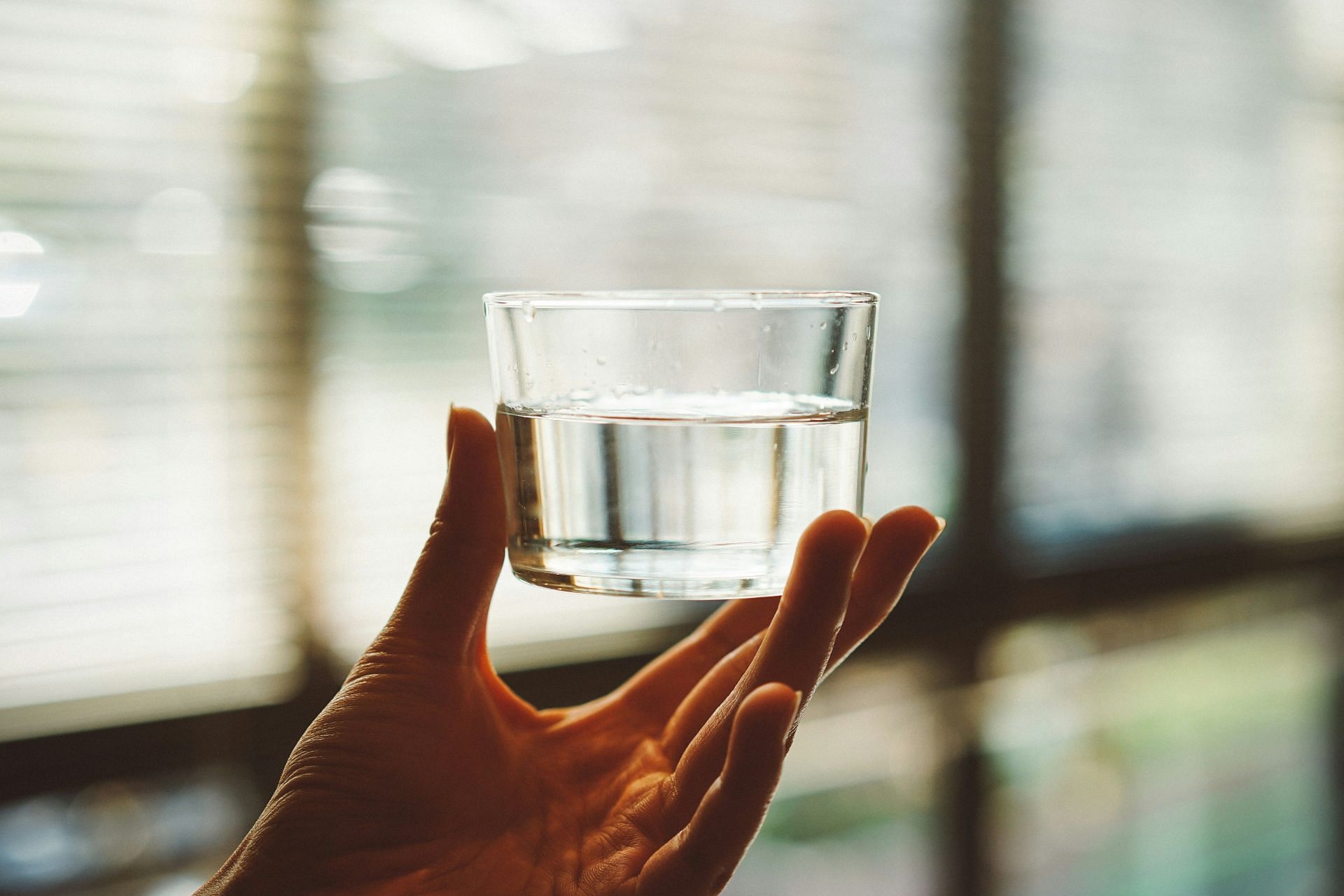Drink lots of water to prevent painful bowel movements. (Image by Manki Kim/Unsplash)