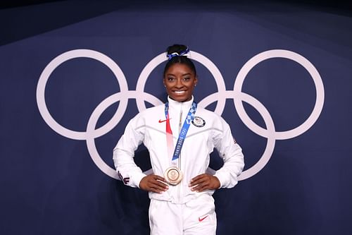 Simone Biles poses with the bronze medal following the Women's Balance Beam Final on day eleven of the Tokyo 2020 Olympic Games at Ariake Gymnastics Centre on August 03, 2021 in Tokyo, Japan. (Photo by Laurence Griffiths/Getty Images)