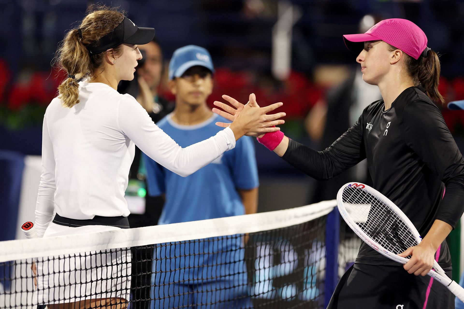 Anna Kalinskaya (L) and Iga Swiatek pictured at the 2024 Dubai Tennis Championships