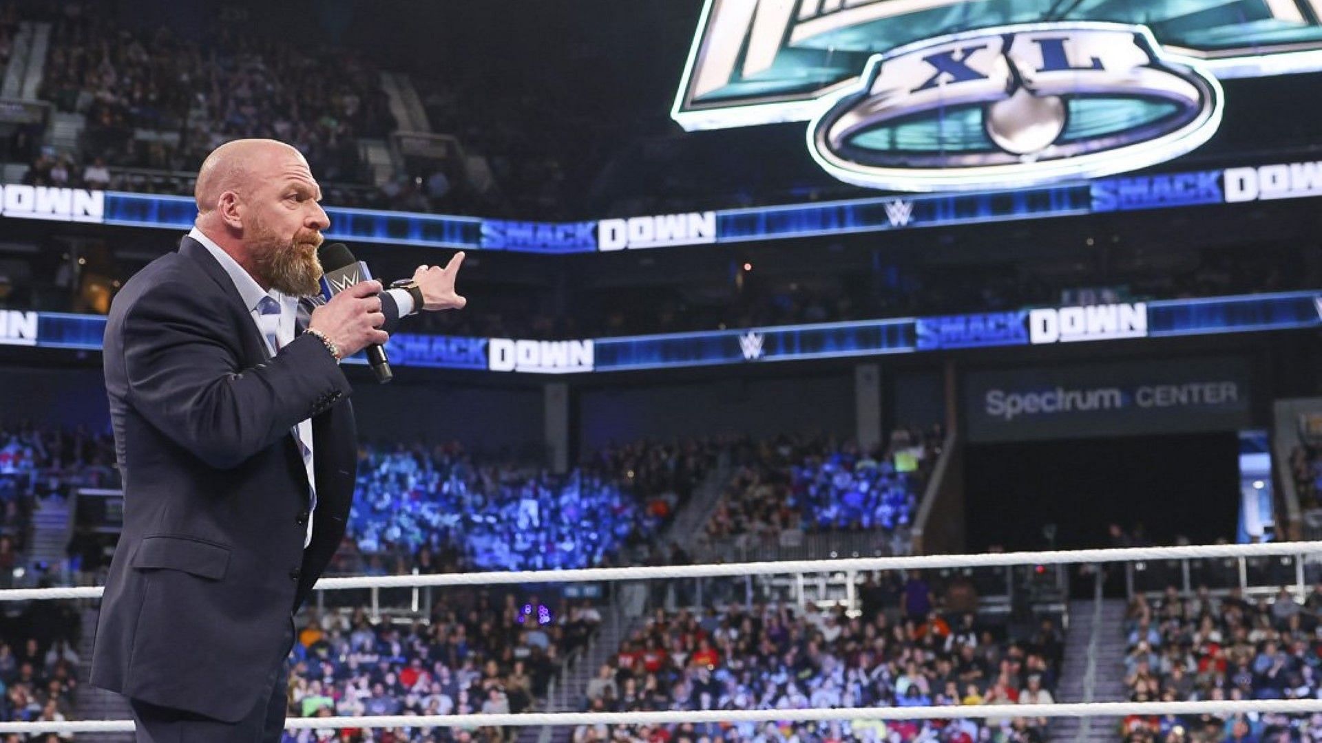Triple H points up to the WWE WrestleMania 40 sign