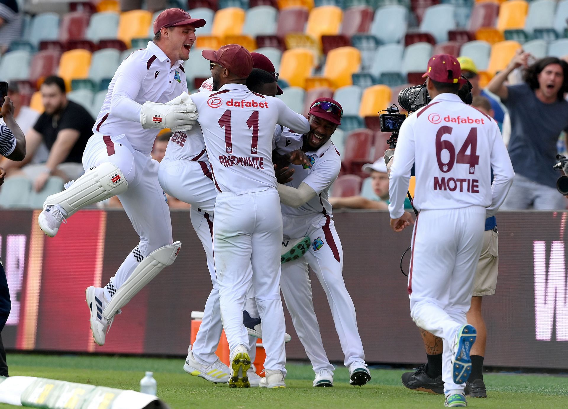 West Indies players mob Shamar after winning in Brisbane. (Credits: Getty)