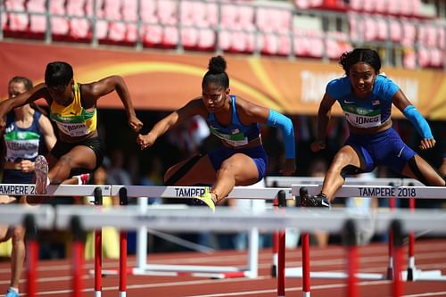 Britany Anderson of Jamaica, Tia Jones of The USA, and Courtney Jones of The USA in action during the final of the women's 100m hurdles on day six of The IAAF World U20 Championships on July 15, 2018, in Tampere, Finland. (Photo by Charlie Crowhurst/Getty Images for IAAF)