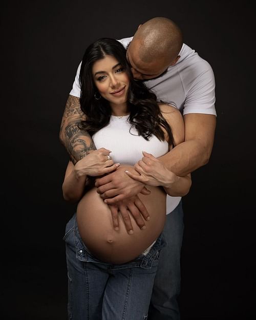 Dak Prescott with Ramos holding her and the baby bump