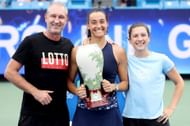 Caroline Garcia with coach Bertrand Perret and trainer Laura Legoupil at the 2022 Western & Southern Open - Getty Images