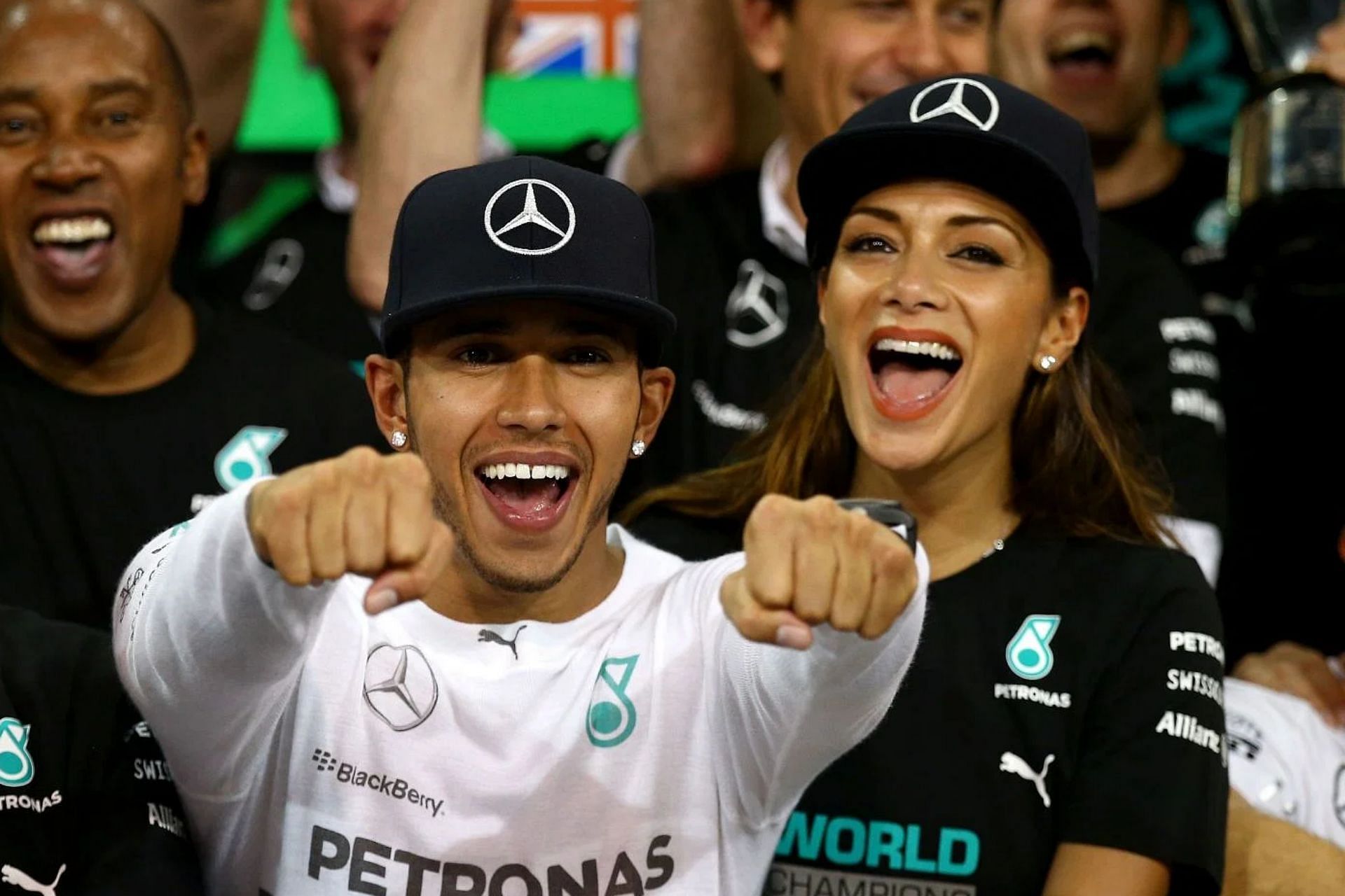 Lewis Hamilton celebrates with his team including Nicole Scherzinger after winning the World Championship after the 2014 F1 Abu Dhabi Grand Prix. (Photo by Clive Rose/Getty Images)