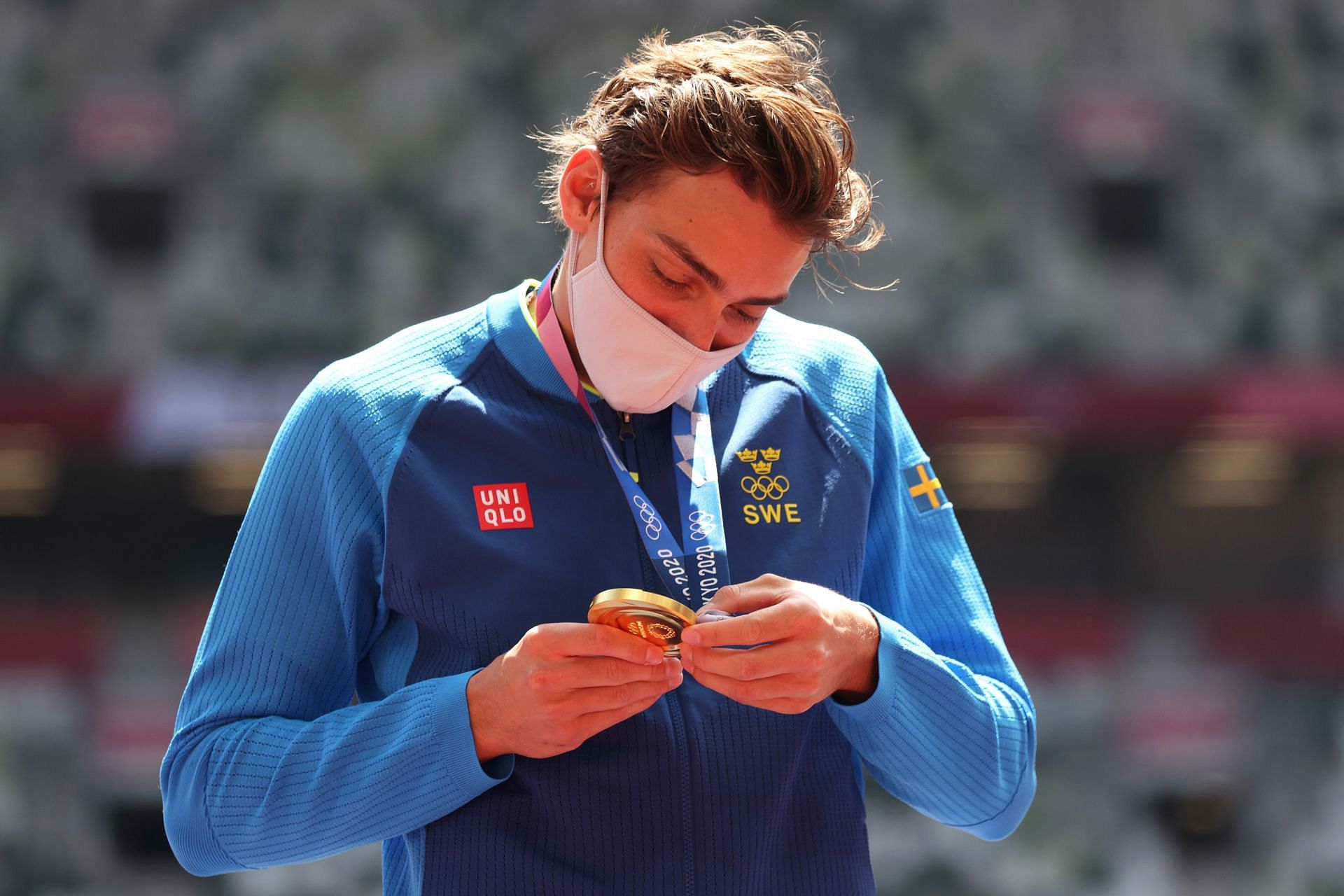 Gold medalist Armand Duplantis looks at his medal during the medal ceremony for the Men&#039;s Pole Vault Final at the 2020 Olympic Games in Tokyo, Japan.
