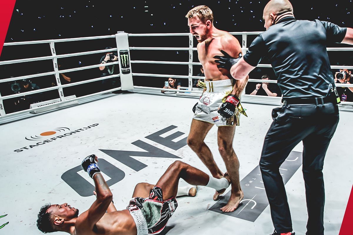 Jonathan Haggerty standing over Felipe Lobo [Photo via: ONE Championship]