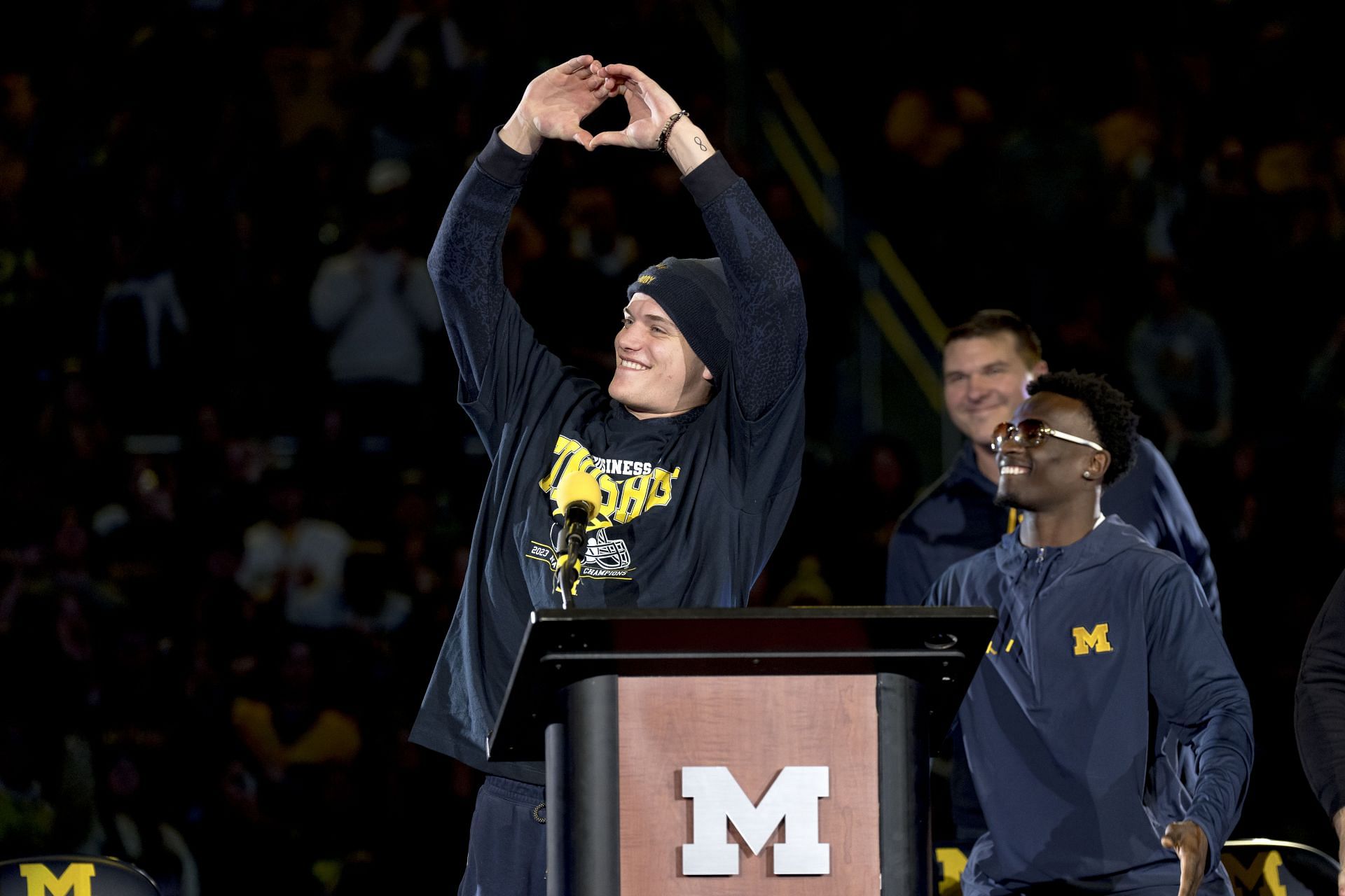 Former QB McCarthy of the Michigan Wolverines makes a heart with his hands.