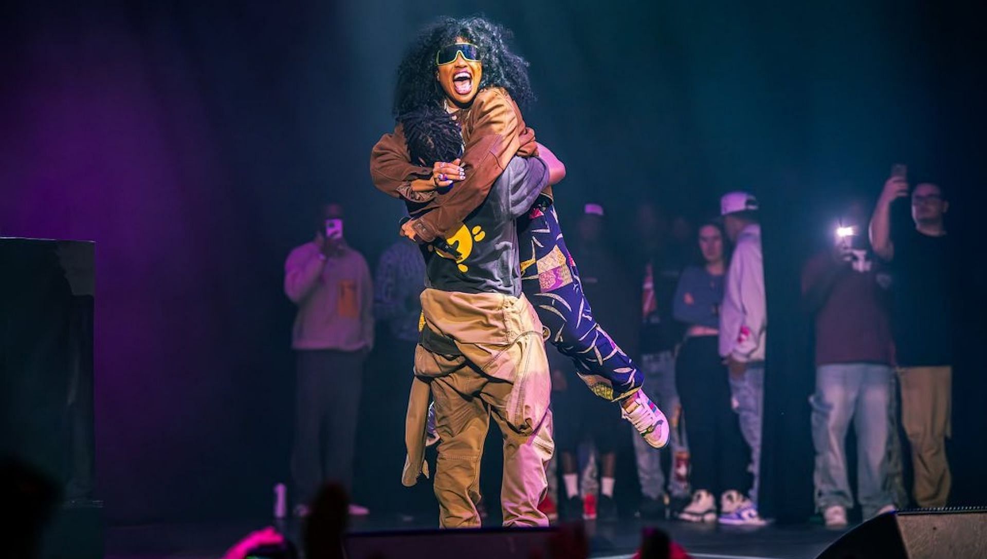 Isaiah Rashad and SZA embrace each other after their live performance at the Cilvia Demo anniversary show hosted by Top Dawg Entertainment (Image via X/ @isaiahrashad)
