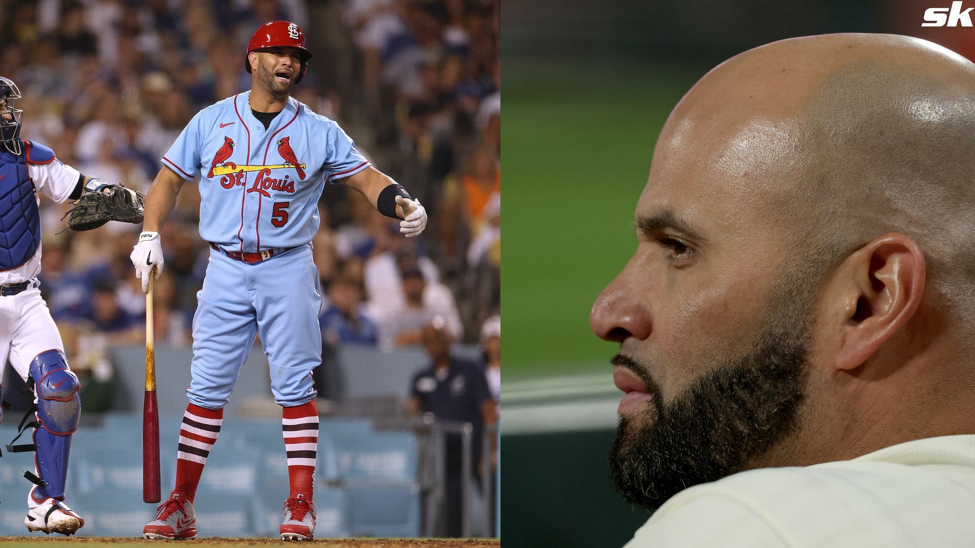 Albert Pujols of the St. Louis Cardinals looks on from the dugout against the Philadelphia Phillies