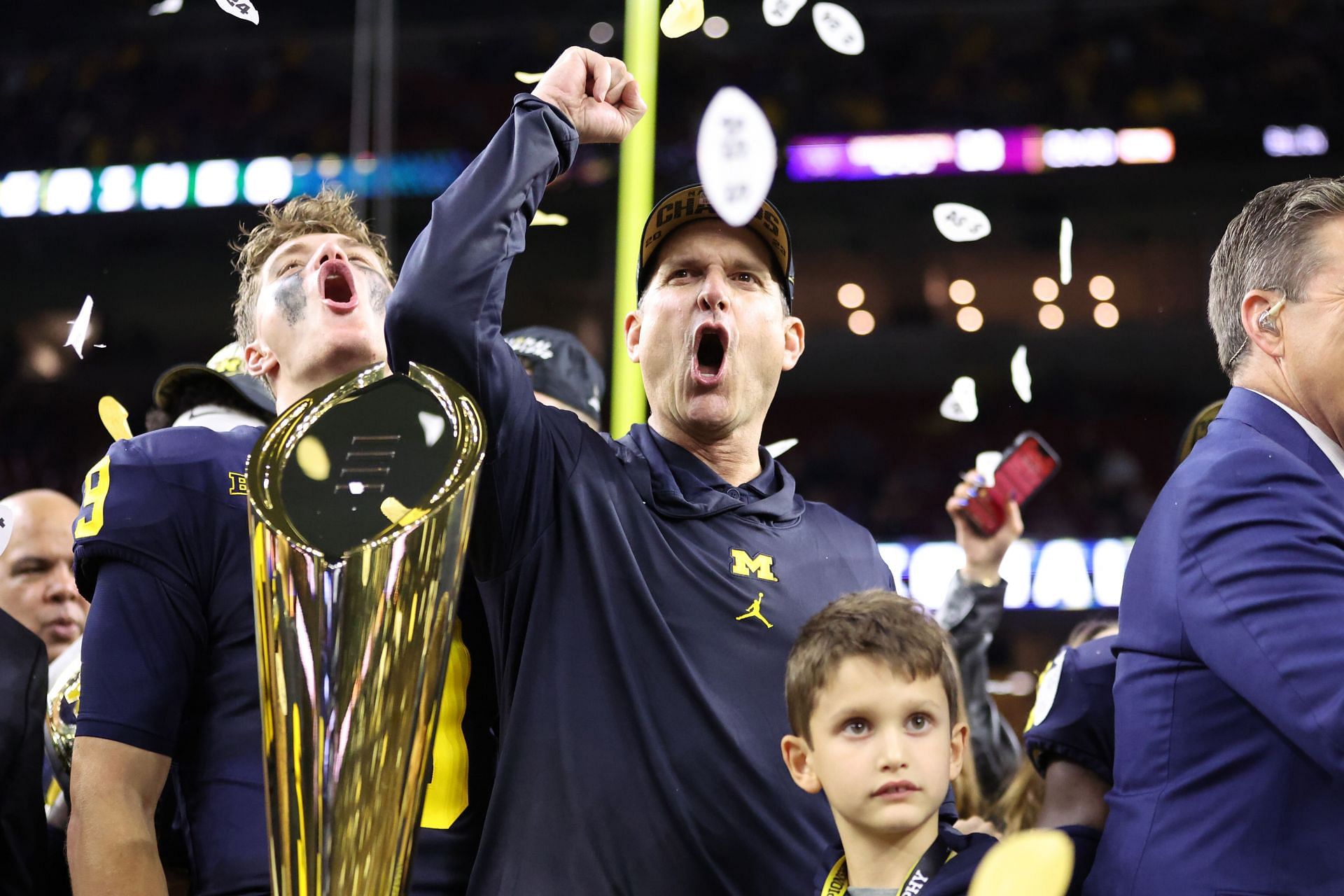 Ex-QB J.J. McCarthy #9 and former head coach Jim Harbaugh of the Michigan Wolverines