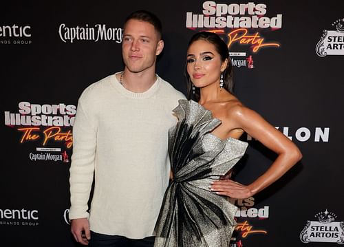 Christian McCaffrey (L) with his partner Olivia Culpo