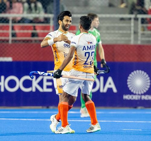 Manpreet Singh celebrates India's goal with Amir Ali