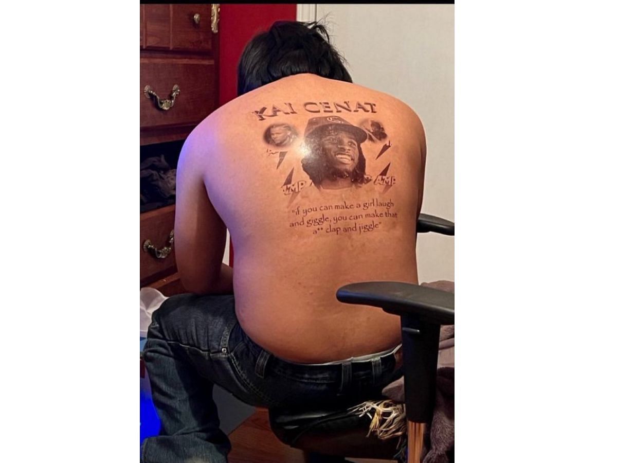 Individual shows off his back tattoo featuring AMP members (Image via X)