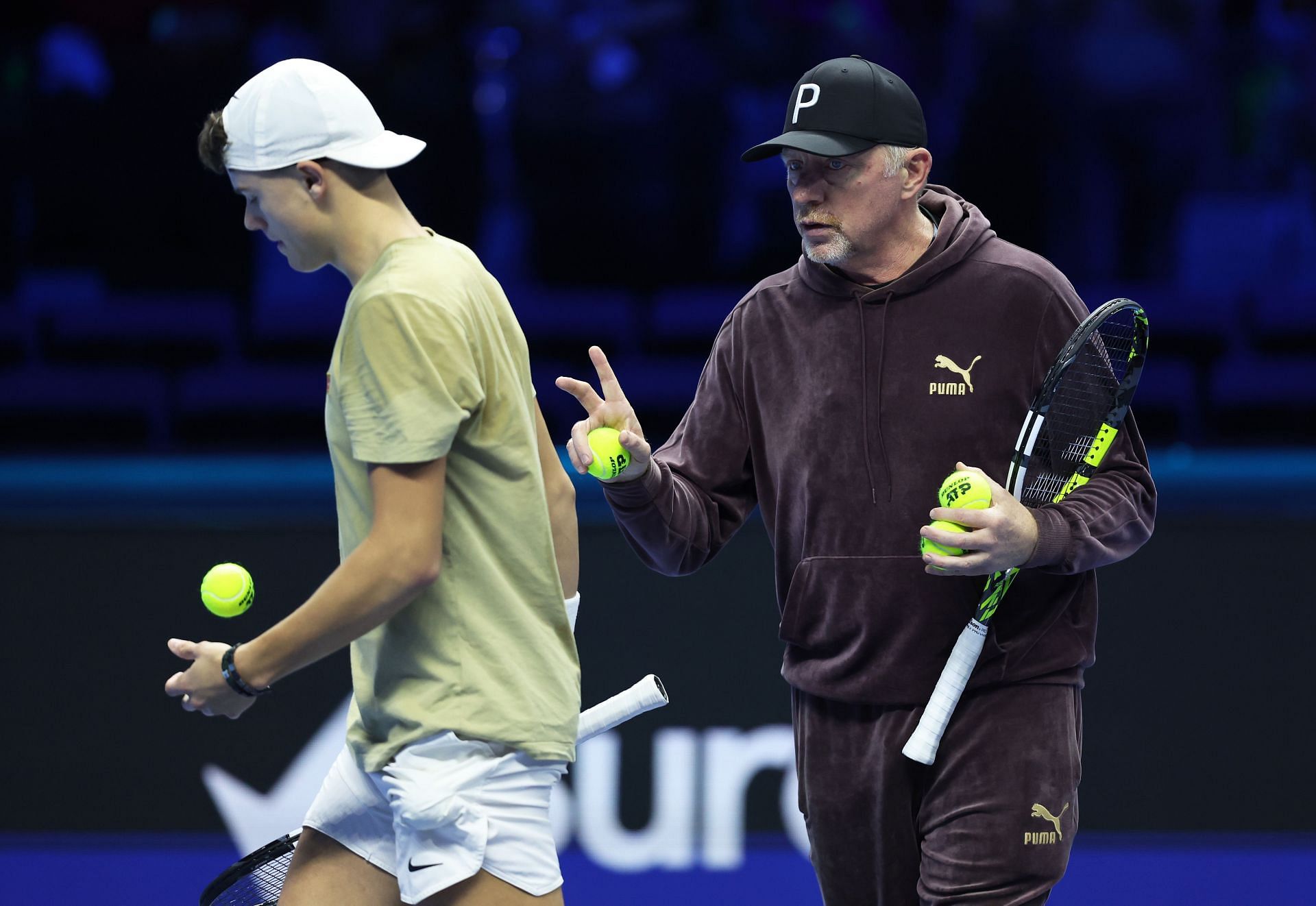 Holger Rune (L) and Boris Becker (R) at the 2023 Nitto ATP Finals