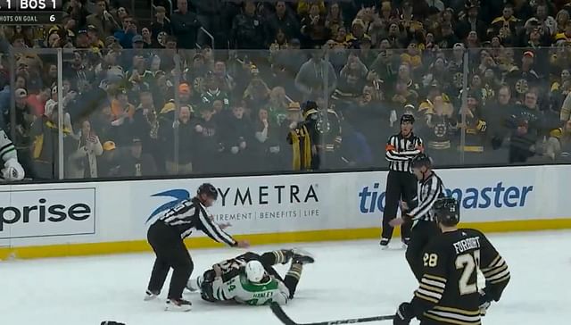 Brad Marchand drops the gloves against Joel Hanley on occasion of his 1,000th NHL game celebration