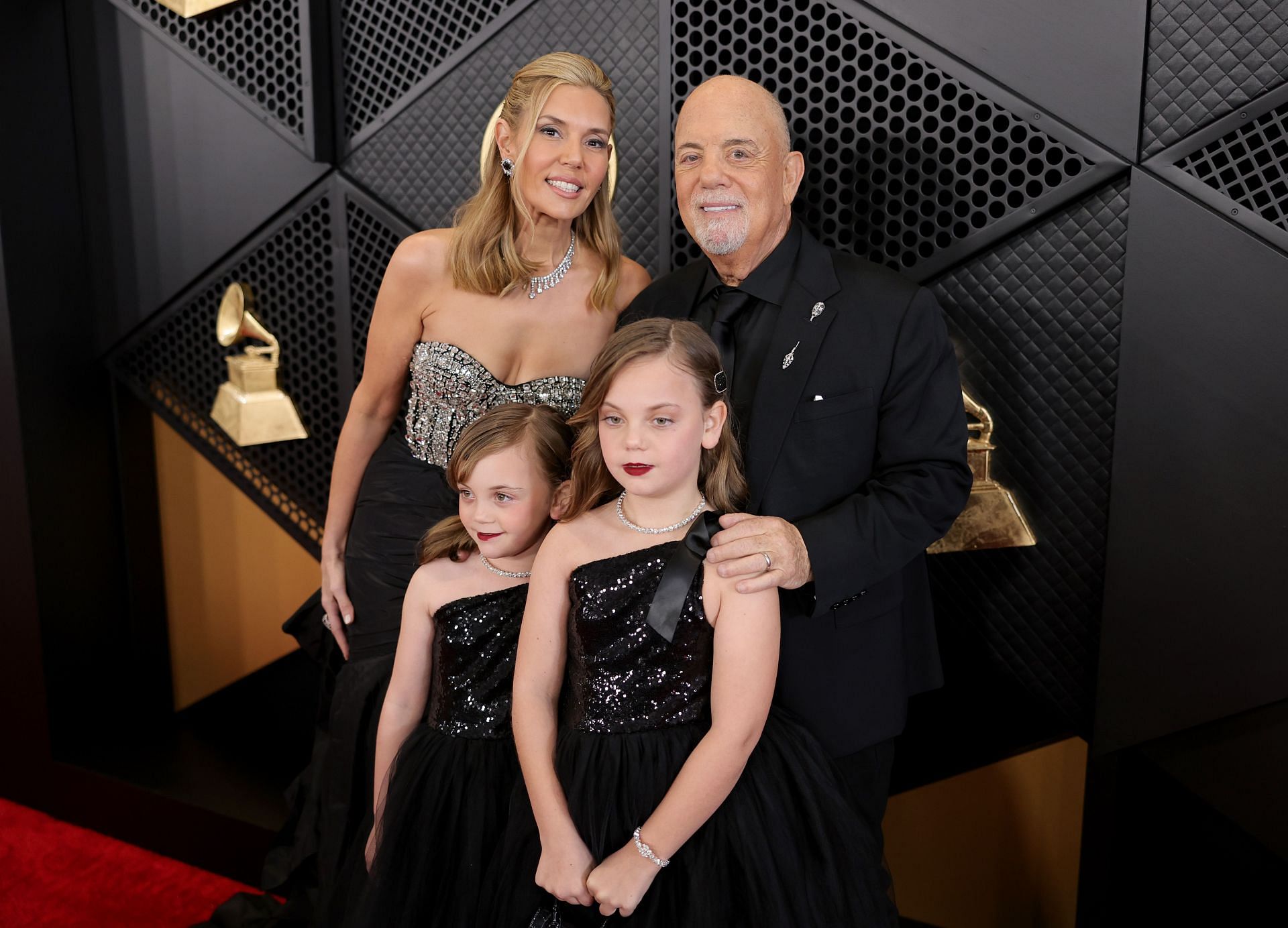 Billy Joel with his family at the Grammys red carpet (Image via Getty Images)