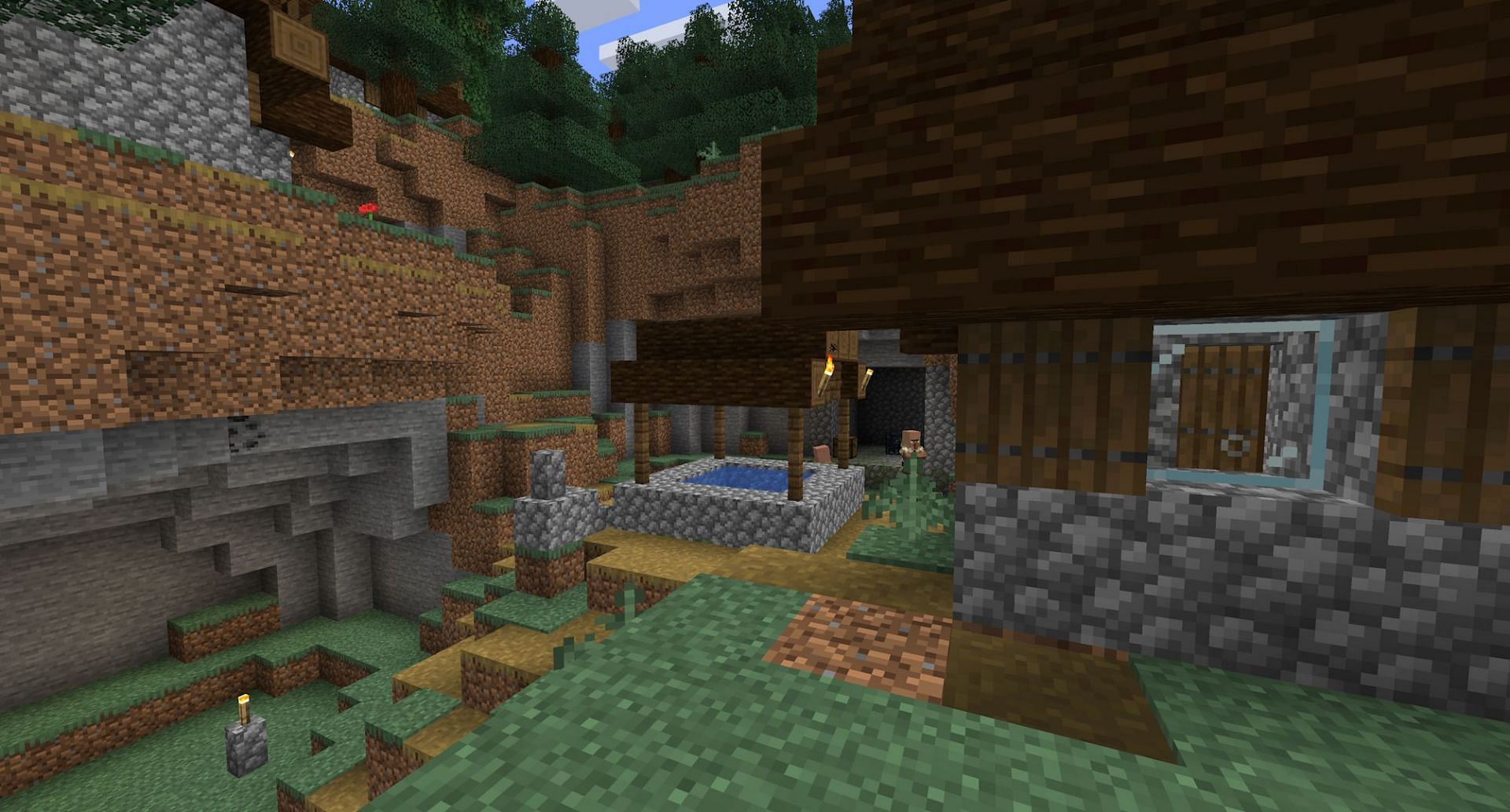 The village with a surface level dungeon (Image via Mojang)