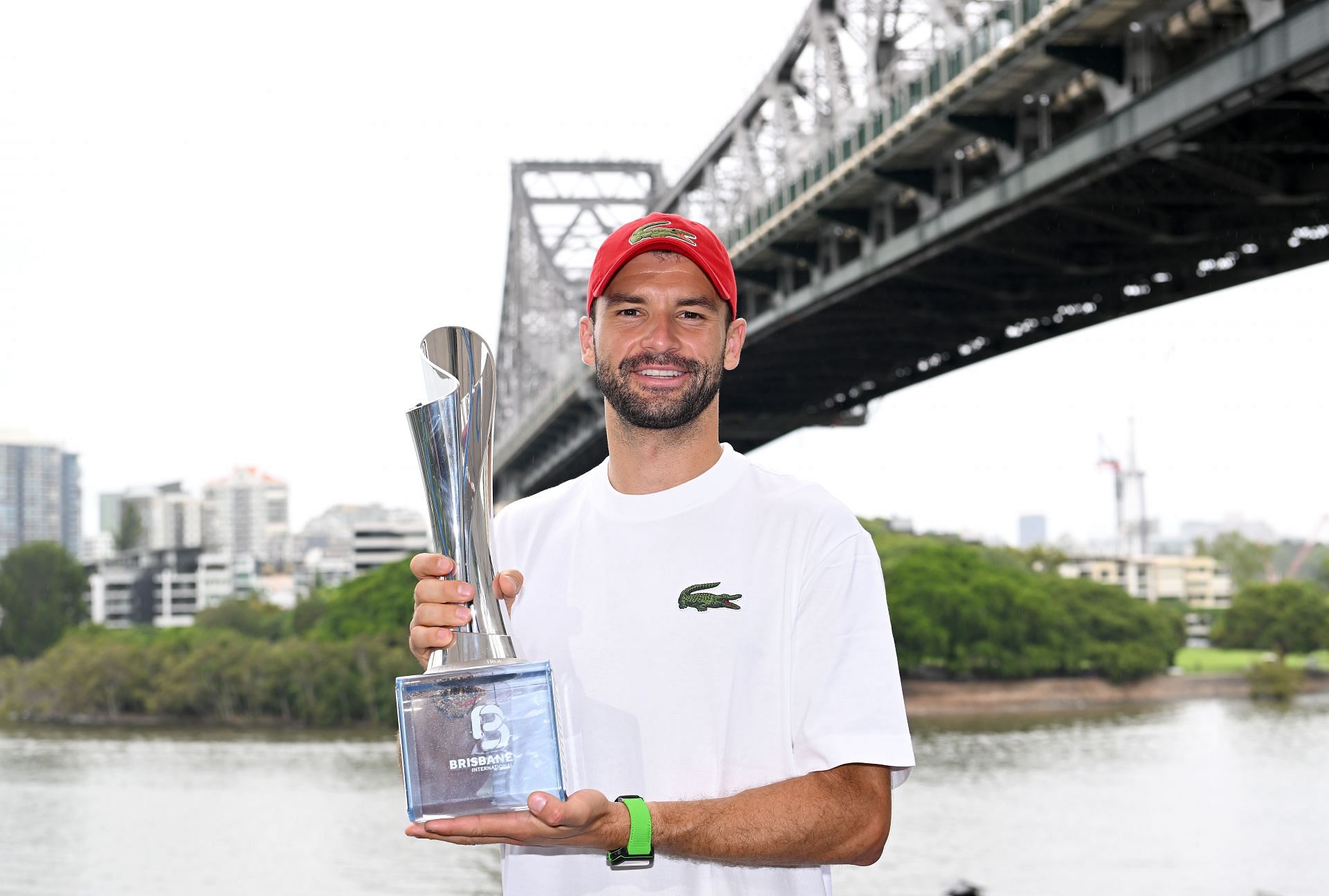 Grigor Dimitrov holds the Brisbane Open 2024 men&#039;s singles trophy.