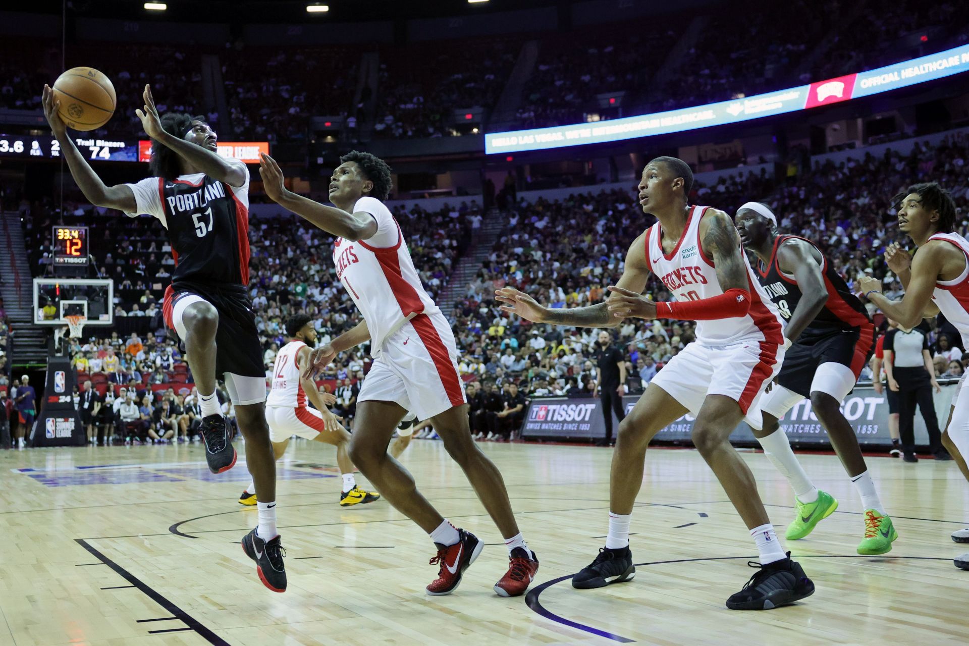 Antoine Davis, shown here in an NBA Summer League game, nearly reached Pete Maravich's scoring record of 3,667 points, falling three shy. Can Caitlin Clark pass Davis and Maravich?