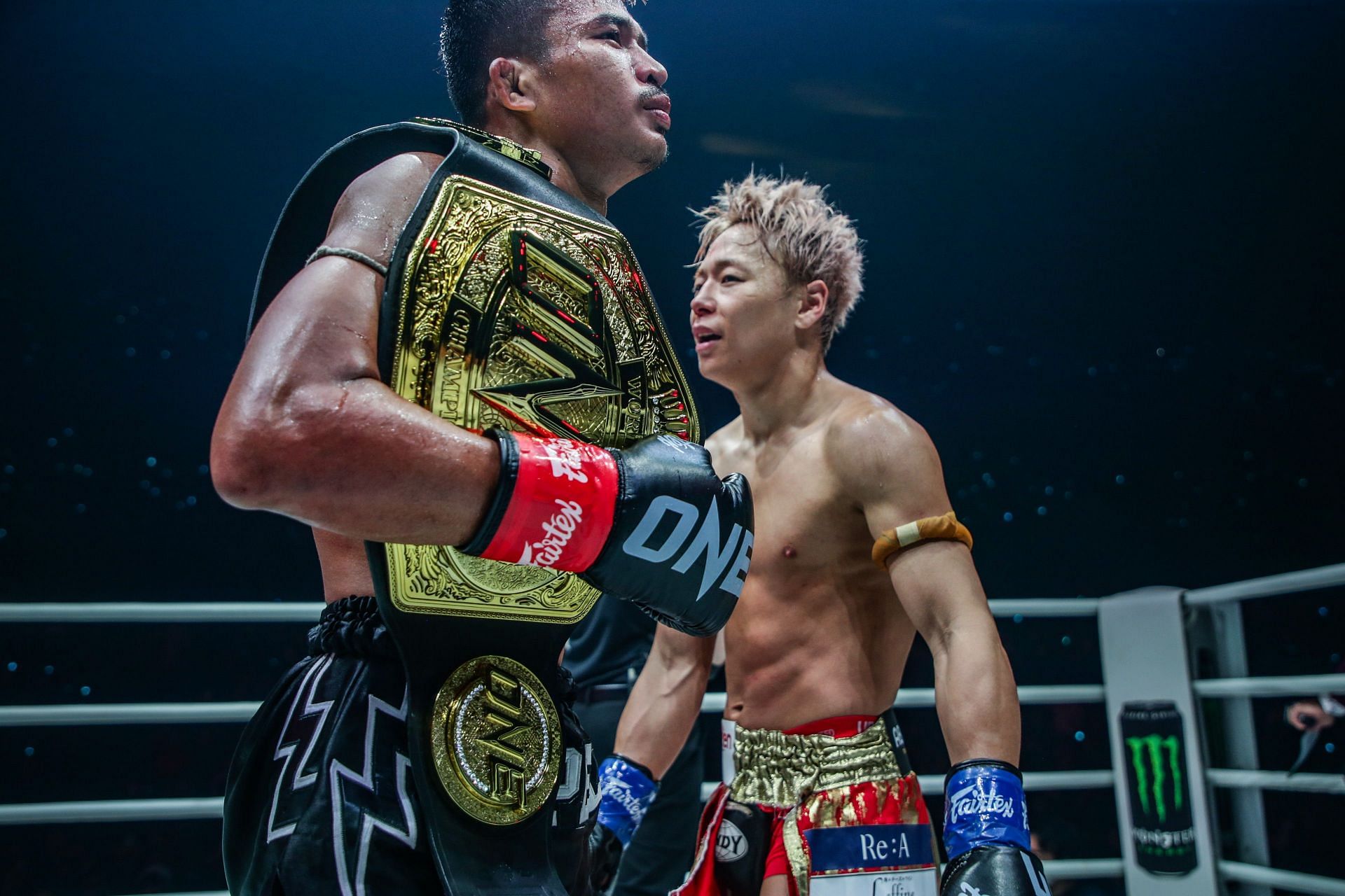 Takeru (right) congratulates Superlek after their flyweight kickboxing title fight in Tokyo.