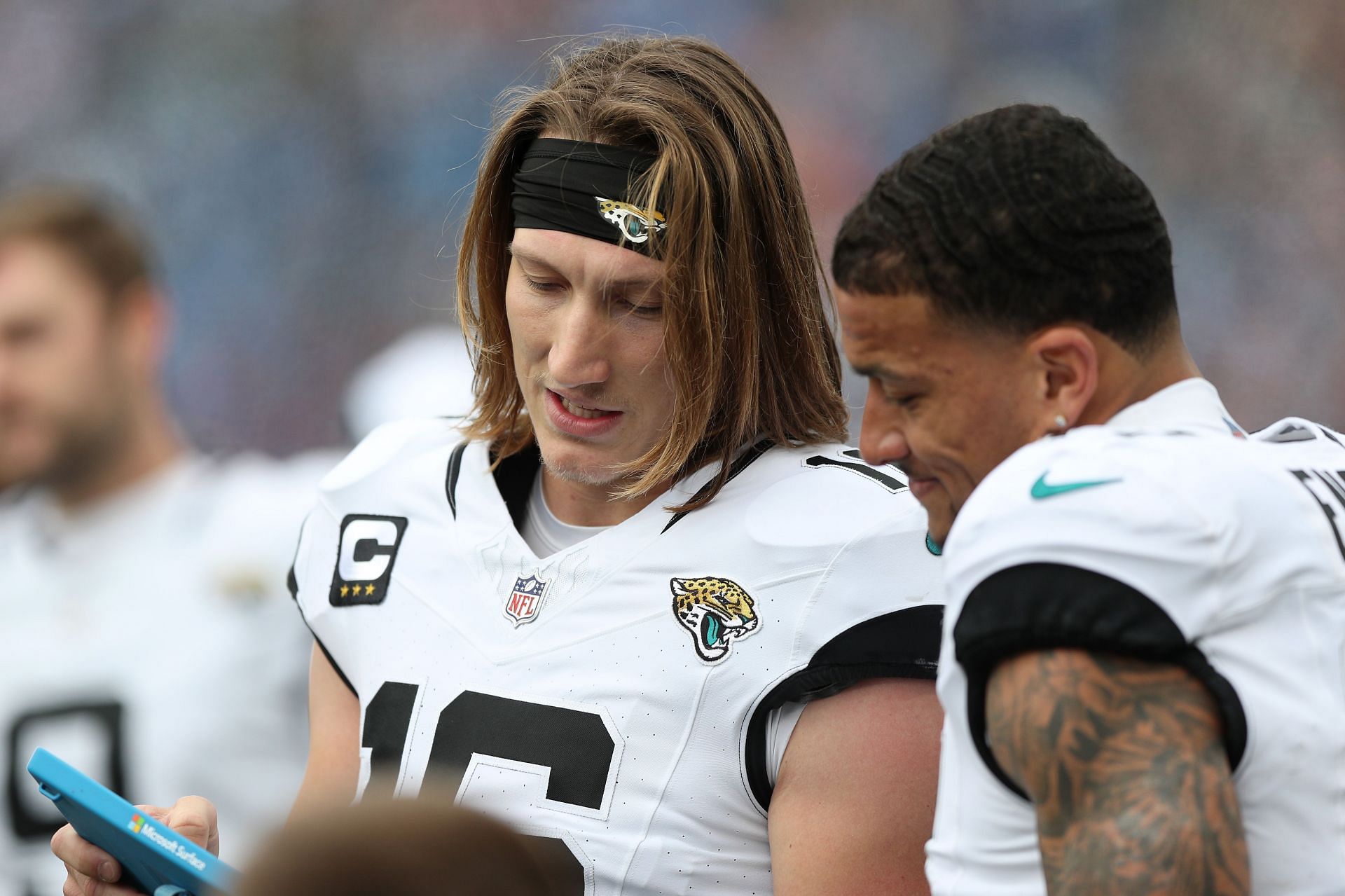 QB Trevor Lawrence (left) is one of many Clemson alums in the NFL..