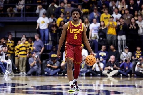 Bronny James #6 of the USC Trojans dribbles the ball down court.