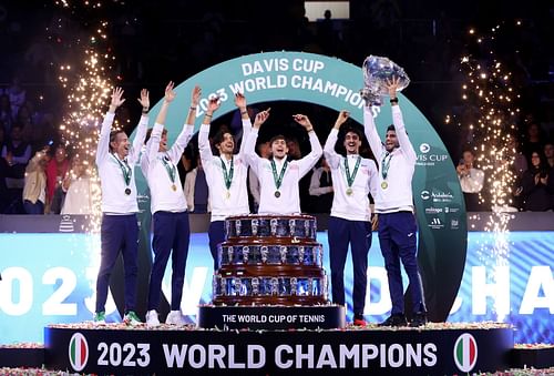 Jannik Sinner and the Italian team with the Davis Cup trophy after their 2-0 final win over Australia.