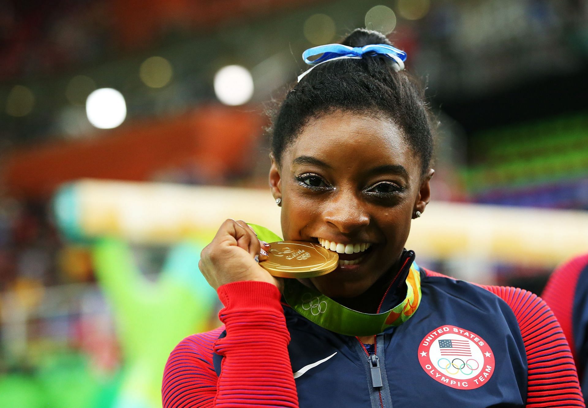 Gold medalist Simone Biles poses for photographs after the medal ceremony for the Women&#039;s Individual All-Around at the 2016 Rio Olympics in Brazil.
