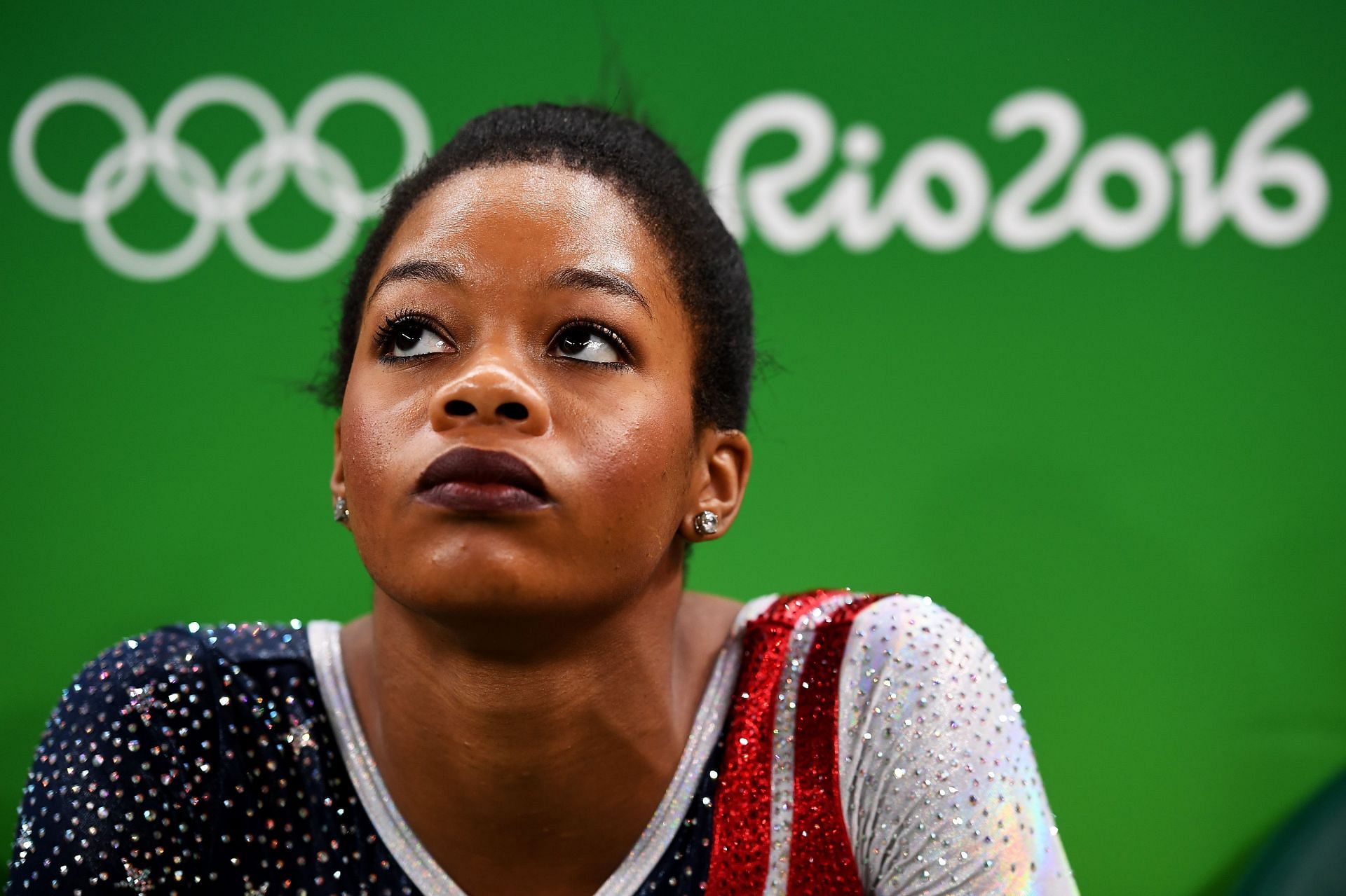 Gabby Douglas of the United States looks on during the Artistic Gymnastics Women&#039;s Team Final at the 2016 Olympic Games in Rio de Janeiro, Brazil.