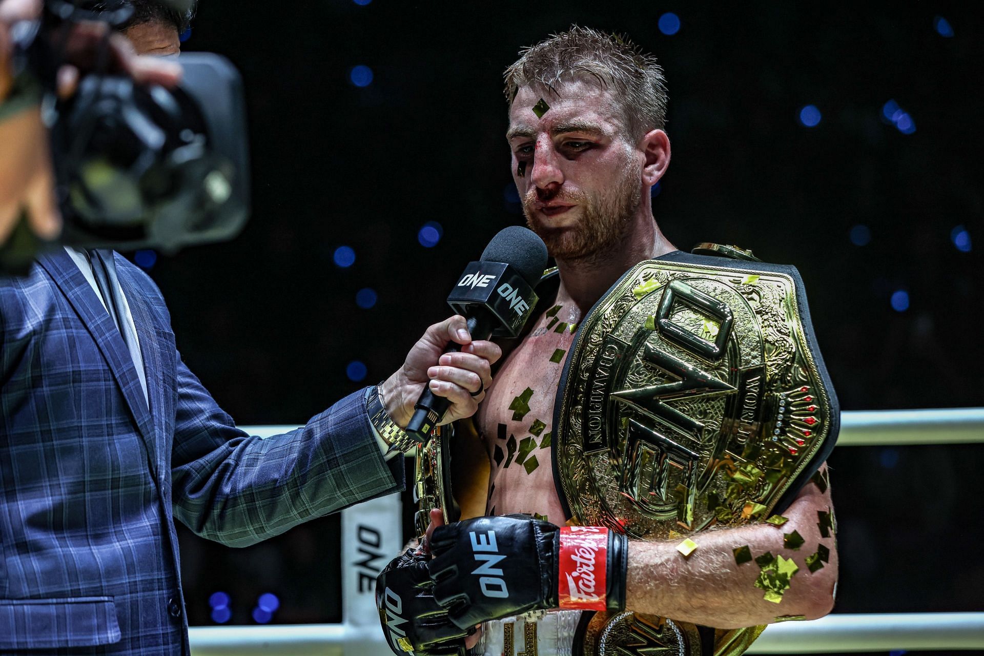 Jonathan Haggerty speaks to Mitch Chilson in the ring after stopping Felipe Lobo at Lumpinee Stadium.