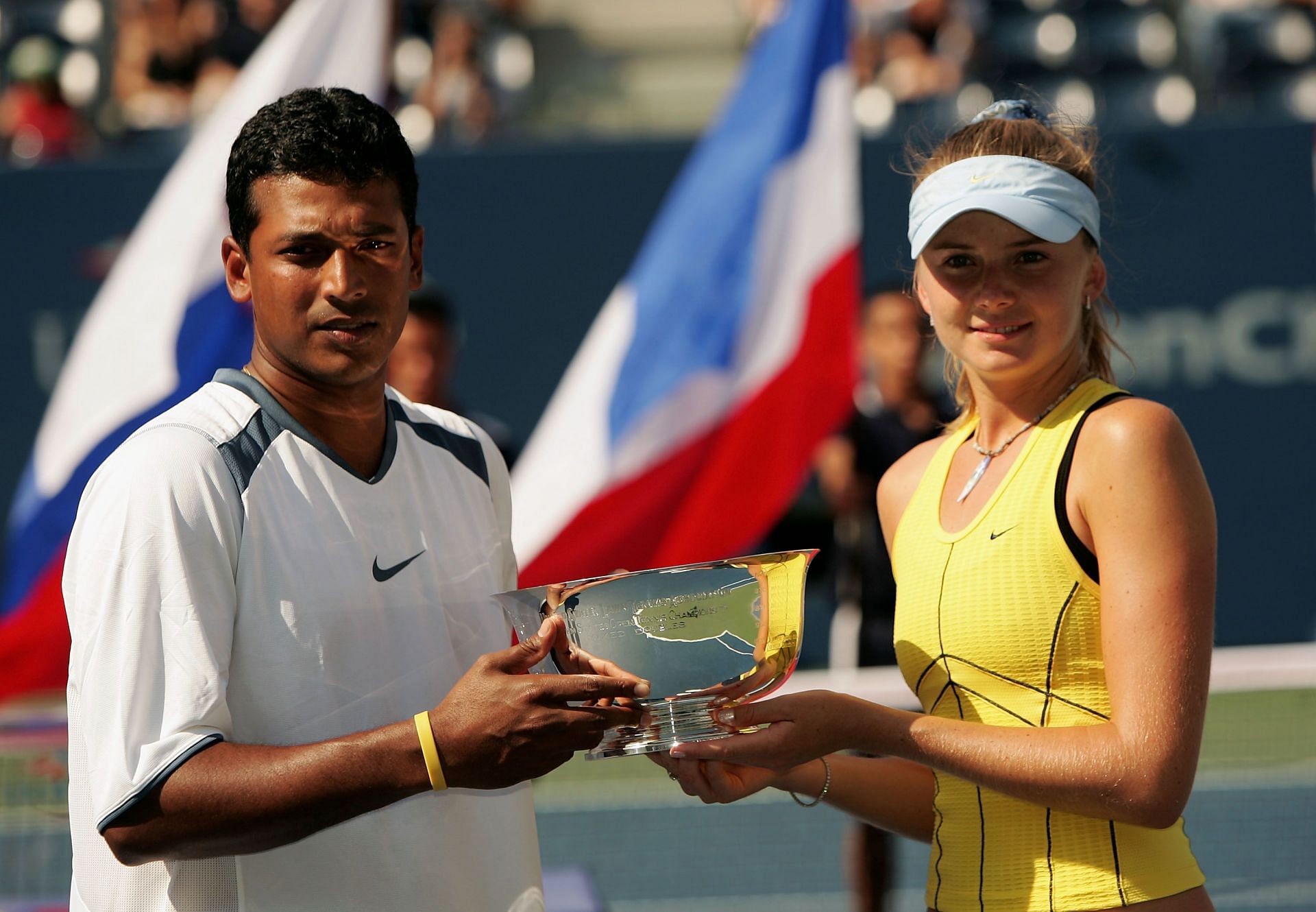 Daniela Hantuchova and Mahesh Bhupathi with the 2005 US Open mixed doubles trophy