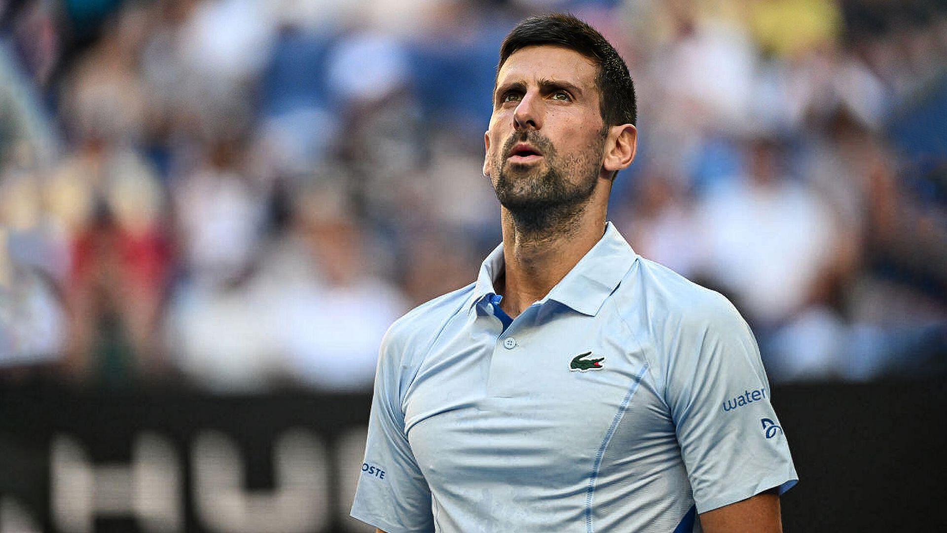 Novak Djokovic reacts after a point on the tennis court