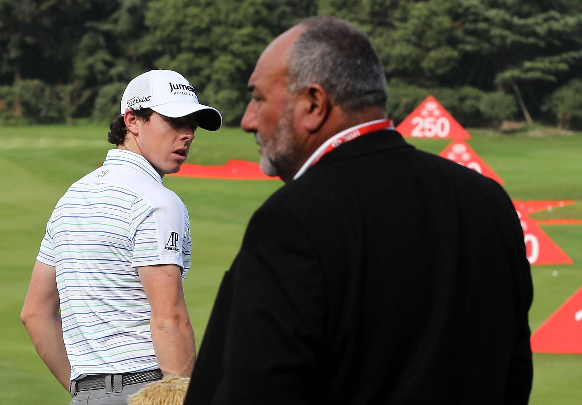 McIlroy and Chubby Chandler at the 2011 HSBC Champions (Image via Getty).