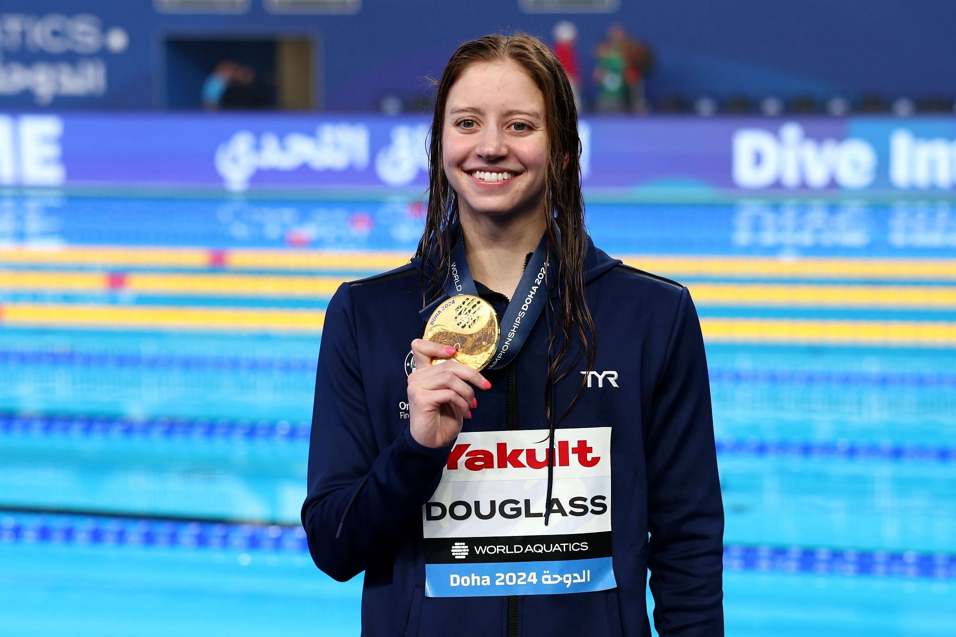 Kate Douglass poses with her medal for the Women's 200m Individual Medley Final at the 2024 World Aquatics Championships in Doha, Qatar.