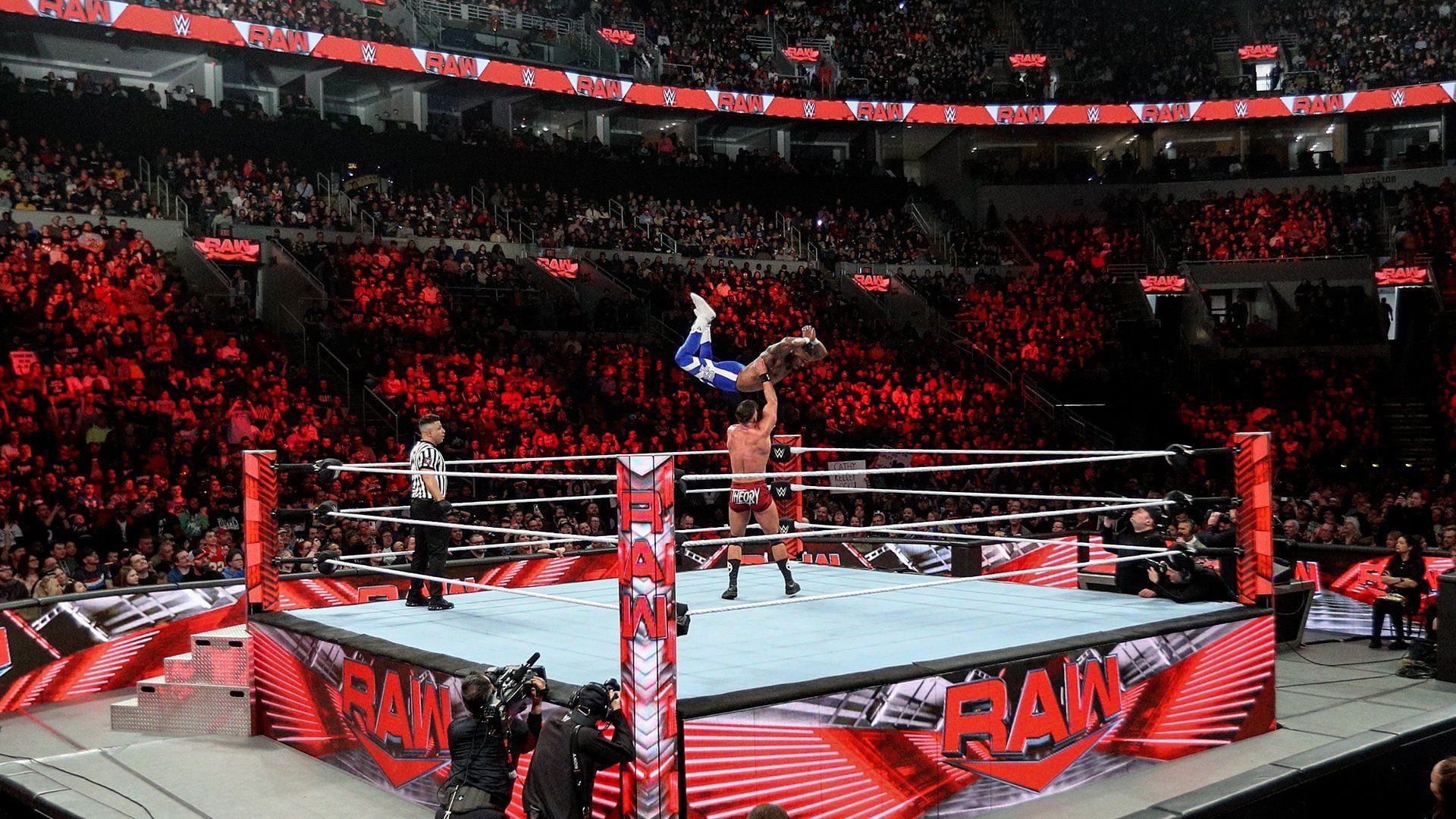 The WWE Universe looks on at two RAW Superstars in action