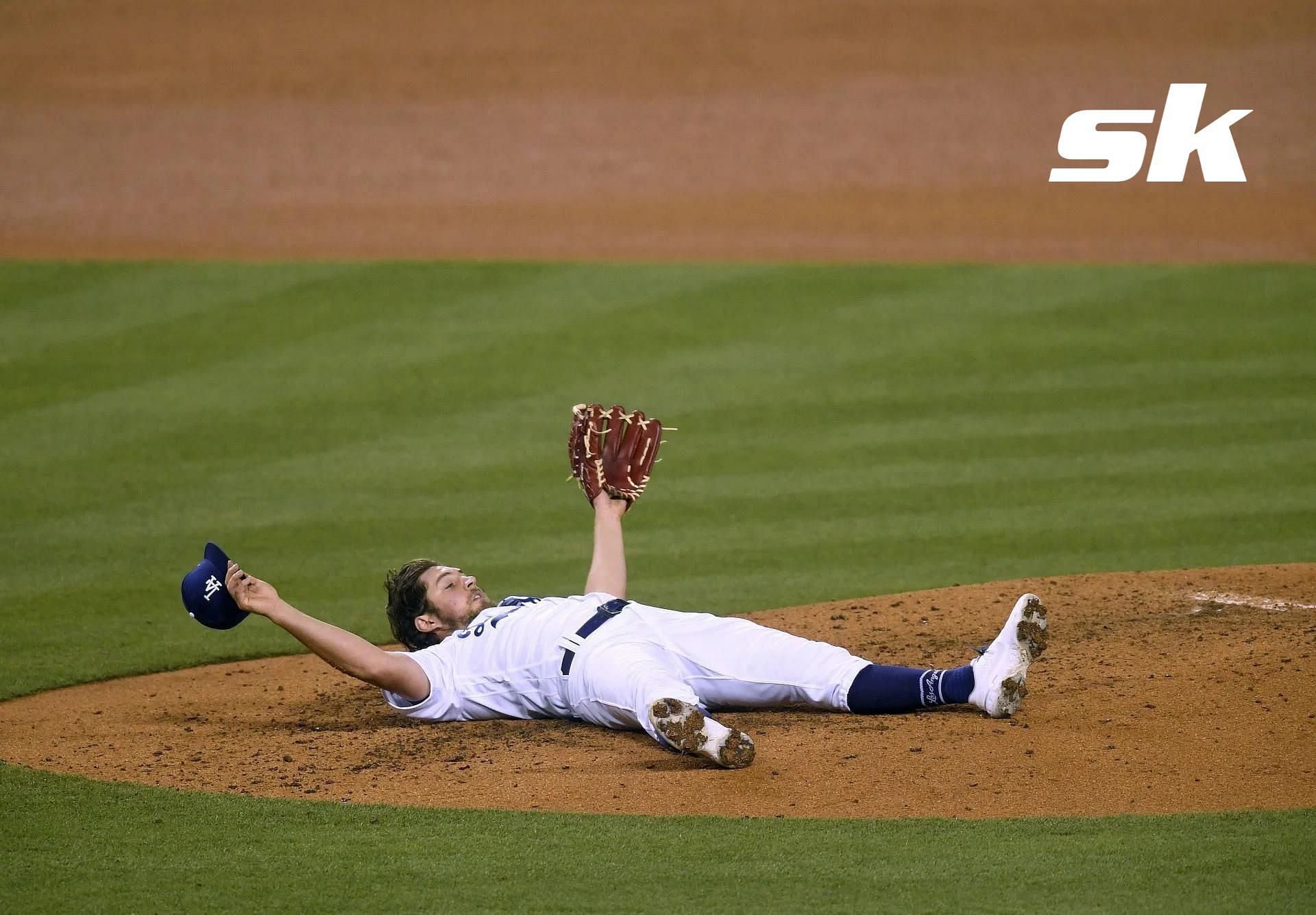 Trevor Bauer lies down on the mound